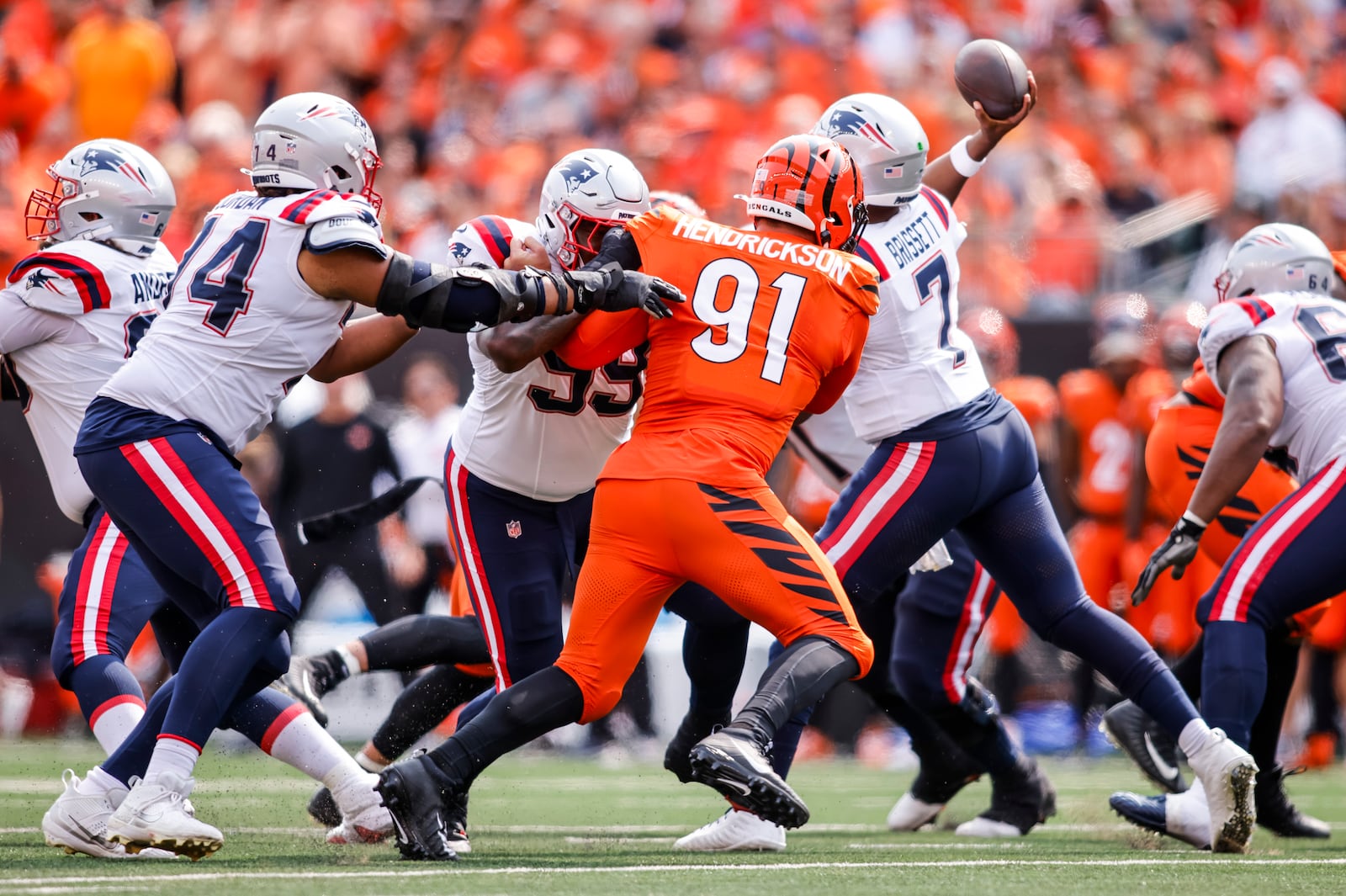 Bengals defensive end Trey Hendrickson pressures Patriots quarterback Jacoby Brissett during their 16-10 loss to New England Patriots Sunday, Sept. 8, 2024 at Paycor Stadium in Cincinnati. NICK GRAHAM/STAFF