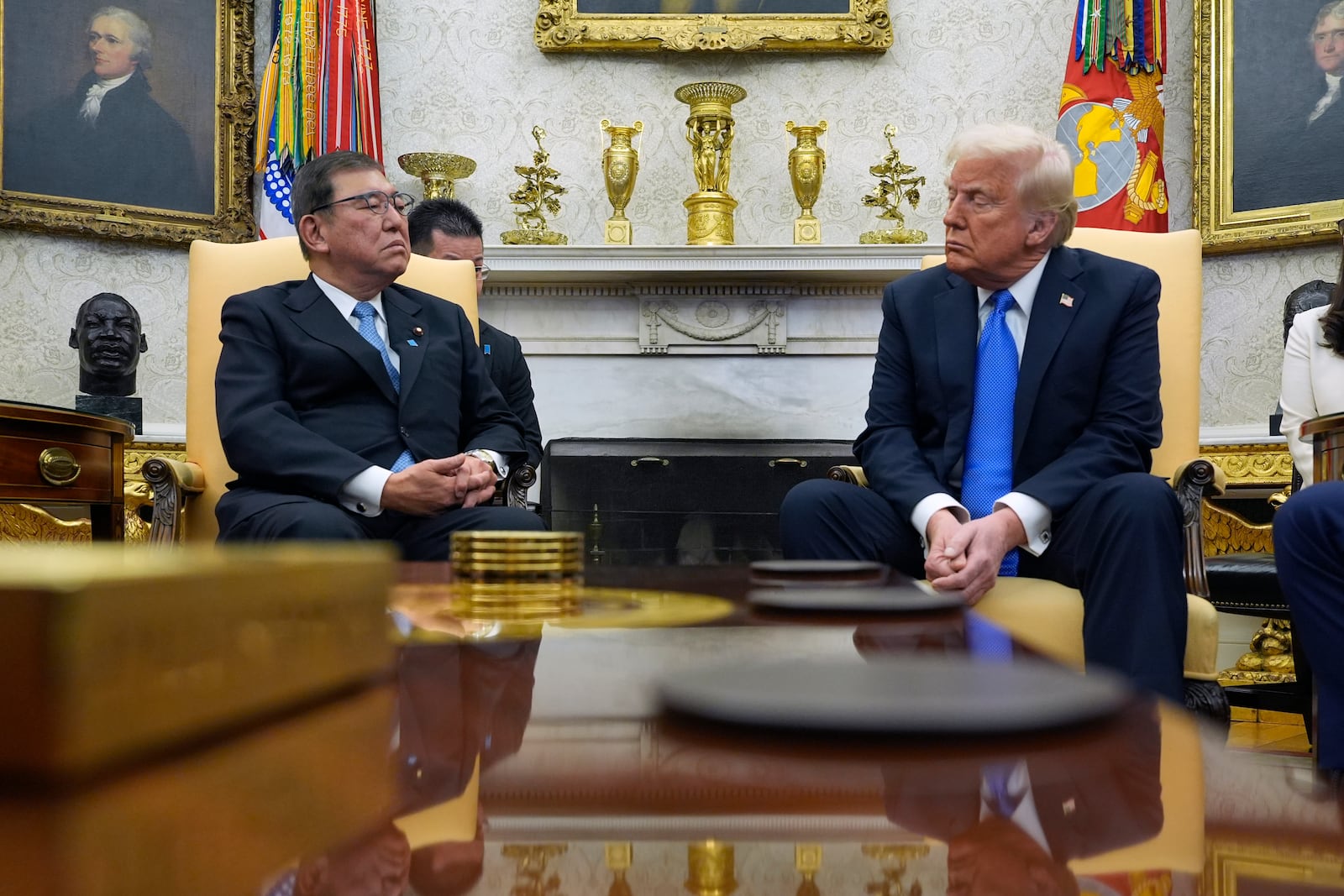 President Donald Trump speaks with Japanese Prime Minister Shigeru Ishiba in the Oval Office of the White House, Friday, Feb. 7, 2025, in Washington. (AP Photo/Alex Brandon)