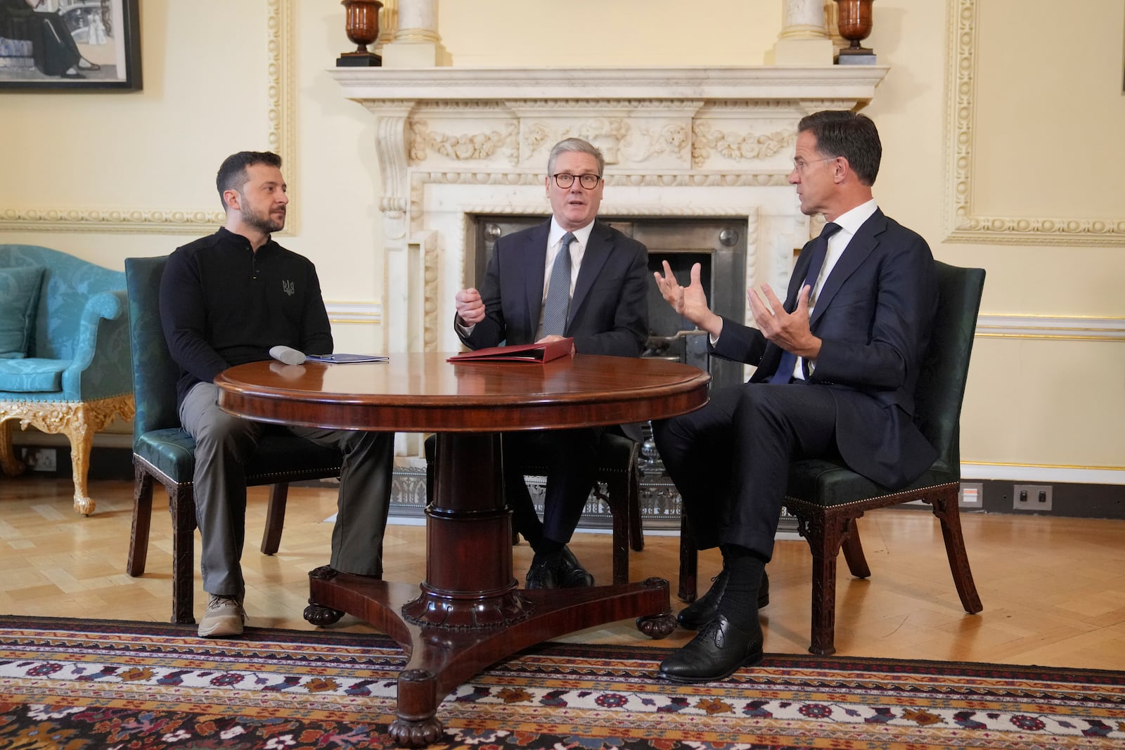 Britain's Prime Minister Keir Starmer, center, NATO Secretary General Mark Rutte, right, and Ukrainian President Volodymyr Zelenskyy meet inside 10 Downing Street in London, Thursday, Oct. 10, 2024.(AP Photo/Kin Cheung, Pool)