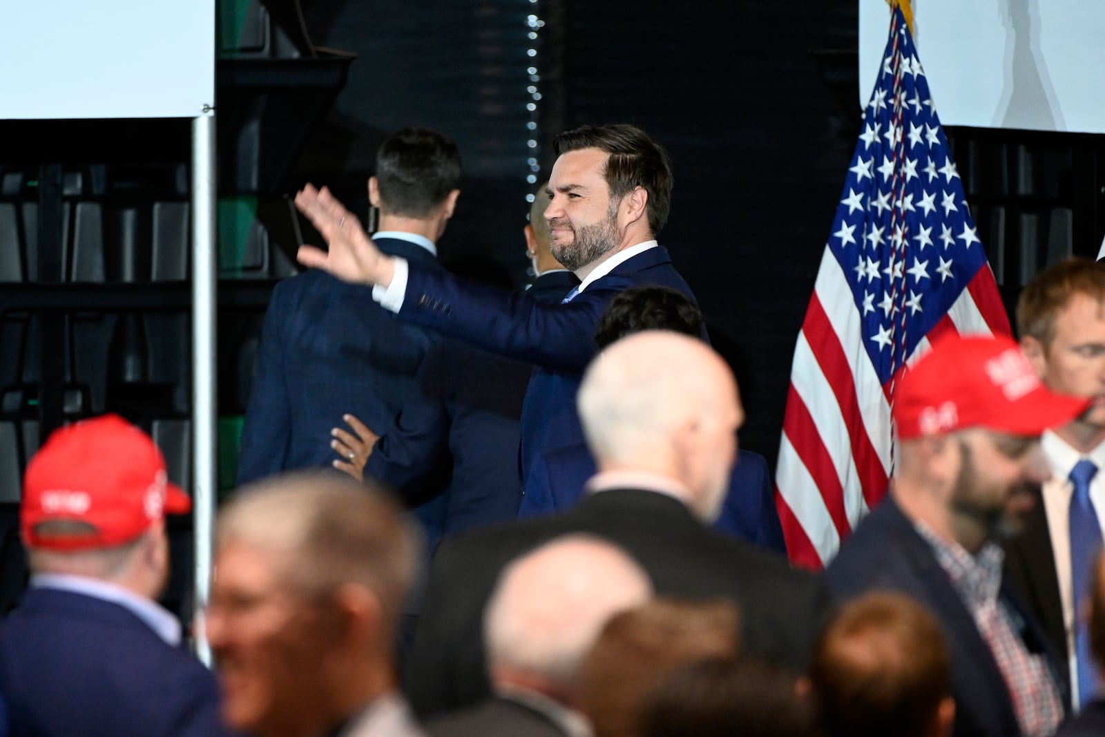 Vice President JD Vance waves following a rally where he spoke about "America's industrial resurgence," Friday, March 14, 2025, at Vantage Plastics in Bay City, Mich. (AP Photo/Jose Juarez)