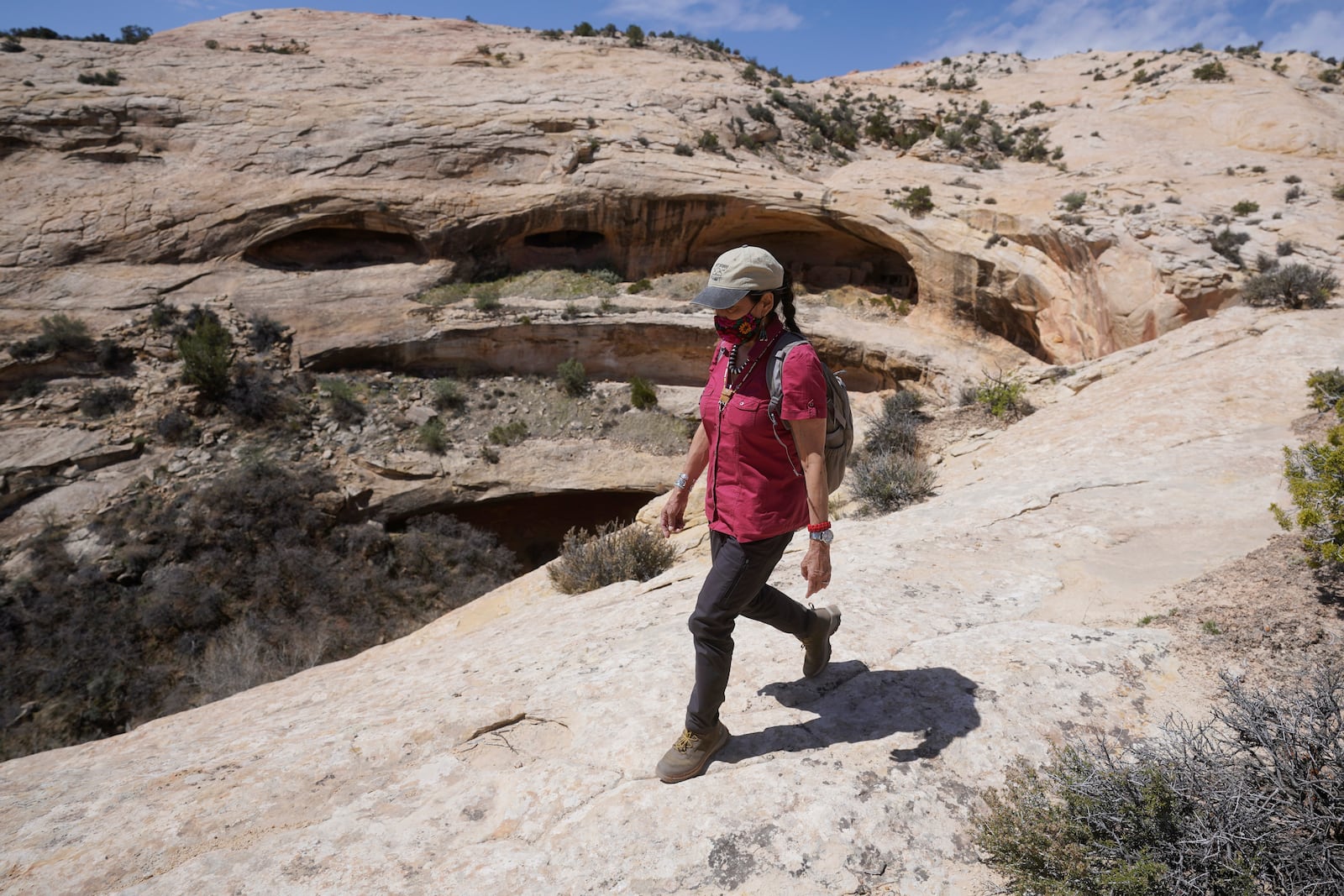 FILE - U.S. Interior Secretary Deb Haaland tours near ancient dwellings along the Butler Wash trail during a visit to Bears Ears National Monument April 8, 2021, near Blanding, Utah. (AP Photo/Rick Bowmer, Pool, File)