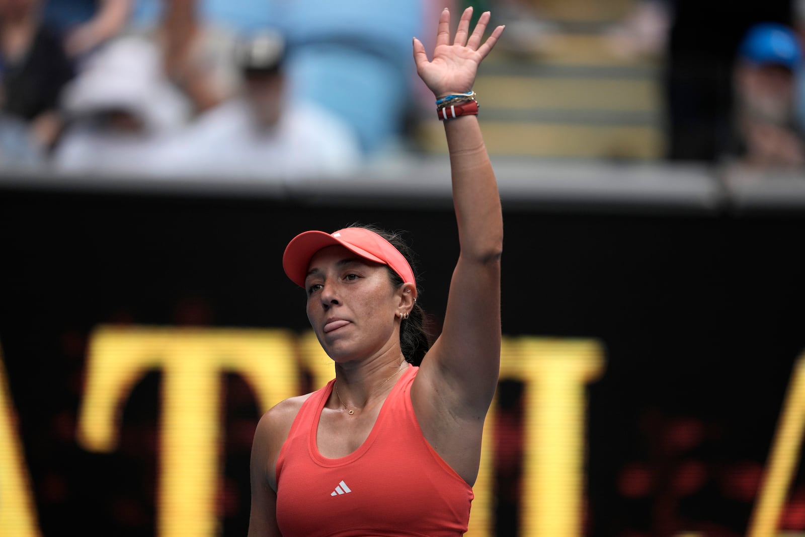 Jessica Pegula of the U.S. waves after defeating Elise Mertens of Belgium in their second round match at the Australian Open tennis championship in Melbourne, Australia, Wednesday, Jan. 15, 2025. (AP Photo/Ng Han Guan)