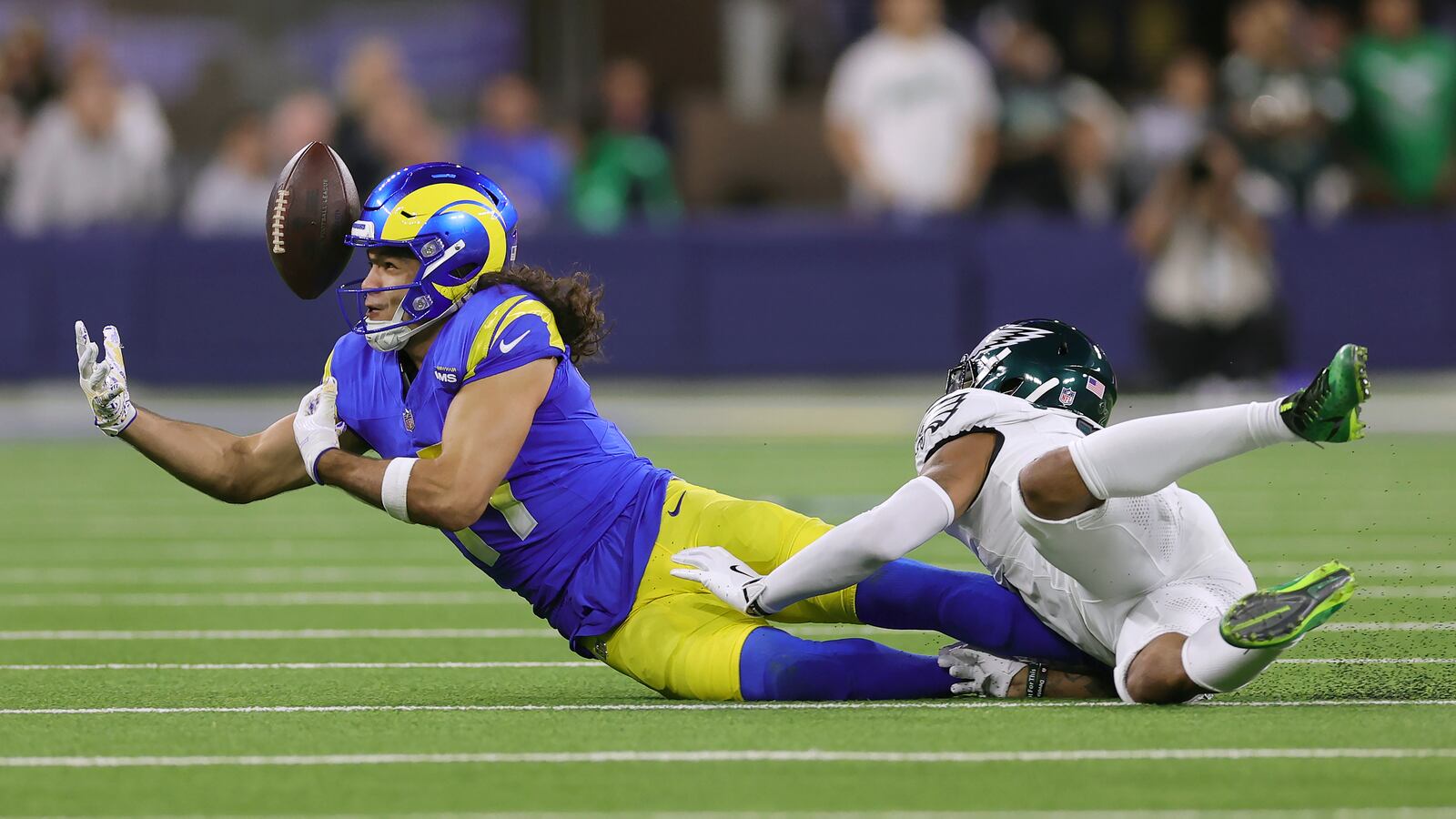 Los Angeles Rams wide receiver Puka Nacua, left, cannot catch a pass against Philadelphia Eagles cornerback Darius Slay Jr. during the first half of an NFL football game in Inglewood, Calif., Sunday, Nov. 24, 2024. (AP Photo/Ryan Sun)