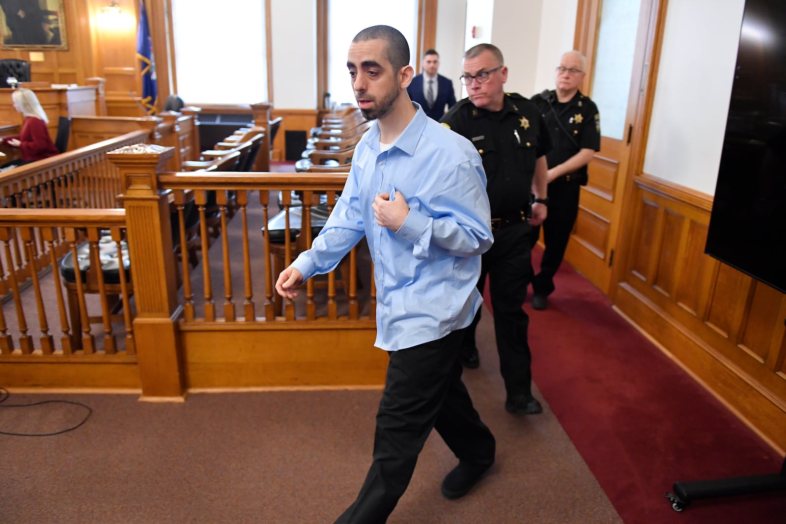 Hadi Matar, charged with severely injuring author Salman Rushdie in a 2022 knife attack, is led in to Chautauqua County court in Mayville, N.Y., Monday, Feb. 10, 2025. (AP Photo/Adrian Kraus)