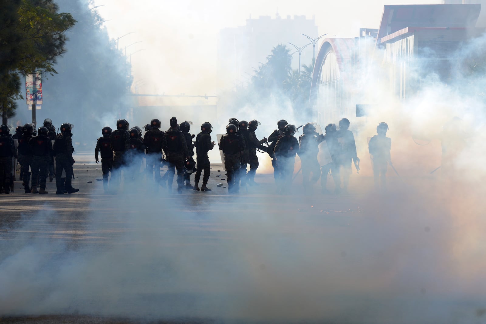 Paramilitary soldiers fire tear gas shells to disperse supporters of imprisoned former premier Imran Khan's Pakistan Tehreek-e-Insaf party, during clashes, in Islamabad, Pakistan, Tuesday, Nov. 26, 2024. (AP Photo/Irtisham Ahmed)