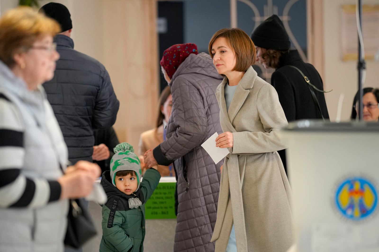 Moldova's President Maia Sandu arrives to cast her vote during a presidential election runoff, in Chisinau, Moldova, Sunday, Nov. 3, 2024. (AP Photo/Vadim Ghirda)