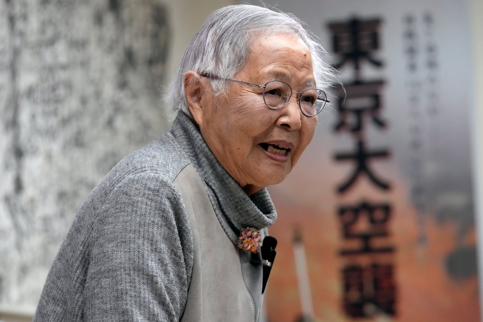 Shizuyo Takeuchi, 94-year-old Tokyo raid survivor, shares her experience in front of a map of the areas damaged during the 1945 Tokyo Firebombing at the Center of the Tokyo Raids and War Damage on Feb. 24, 2025, in Tokyo. (AP Photo/Eugene Hoshiko)