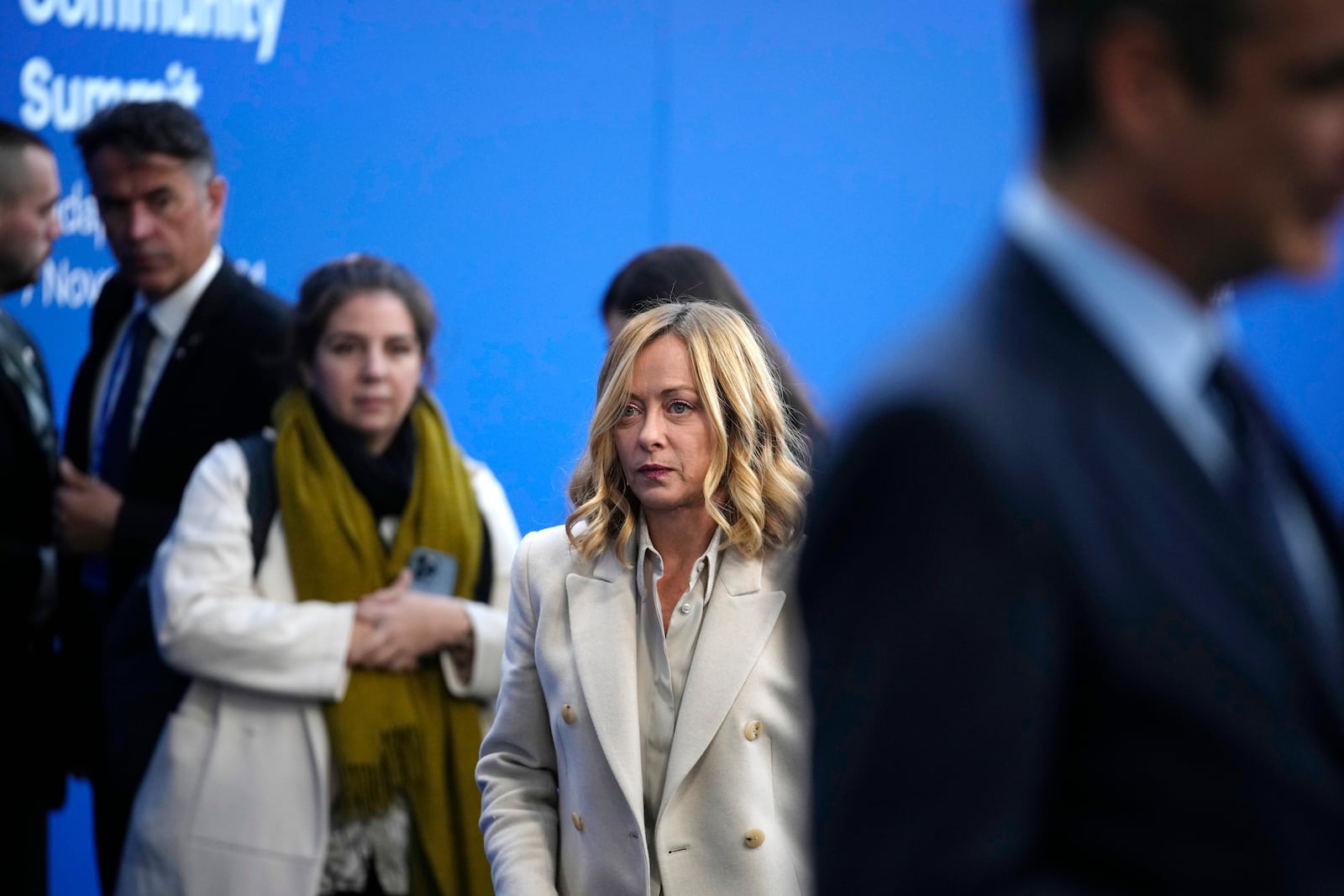 Italy's Prime Minister Giorgia Meloni, center, arrives for the European Political Community (EPC) Summit at the Puskas Arena in Budapest, Hungary, Thursday, Nov. 7, 2024. (AP Photo/Petr Josek)