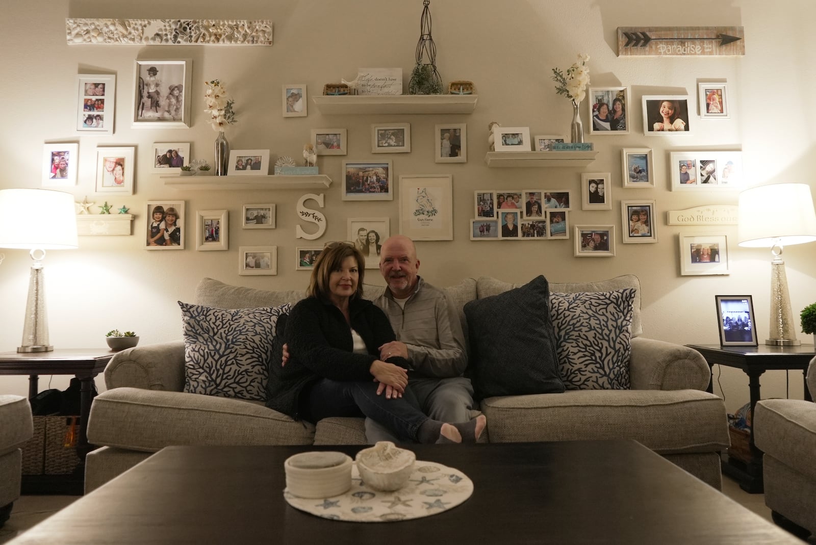 Susan and Greg Scarbro sit for a portrait in their home in Sunset Beach, N.C. on Jan. 3, 2025. (AP Photo/Laura Bargfeld)