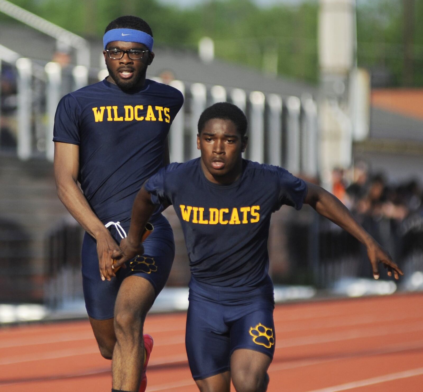 Springfield senior Austin Tyree (left) hands off to Dovon Williams in the 800 relay during the D-I regional track and field meet at Wayne High School on Friday, May 24, 2019. MARC PENDLETON / STAFF