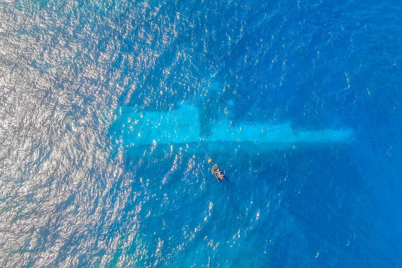 FILE - In this photo provided by the New Zealand Defence Force, divers survey the area around HMNZS Manawanui on the southern coast of Upulo, Samoa, after the Manawanui ran aground and sank on Oct. 6. (AC Jese Somerville/New Zealand Defence Force via AP,File)