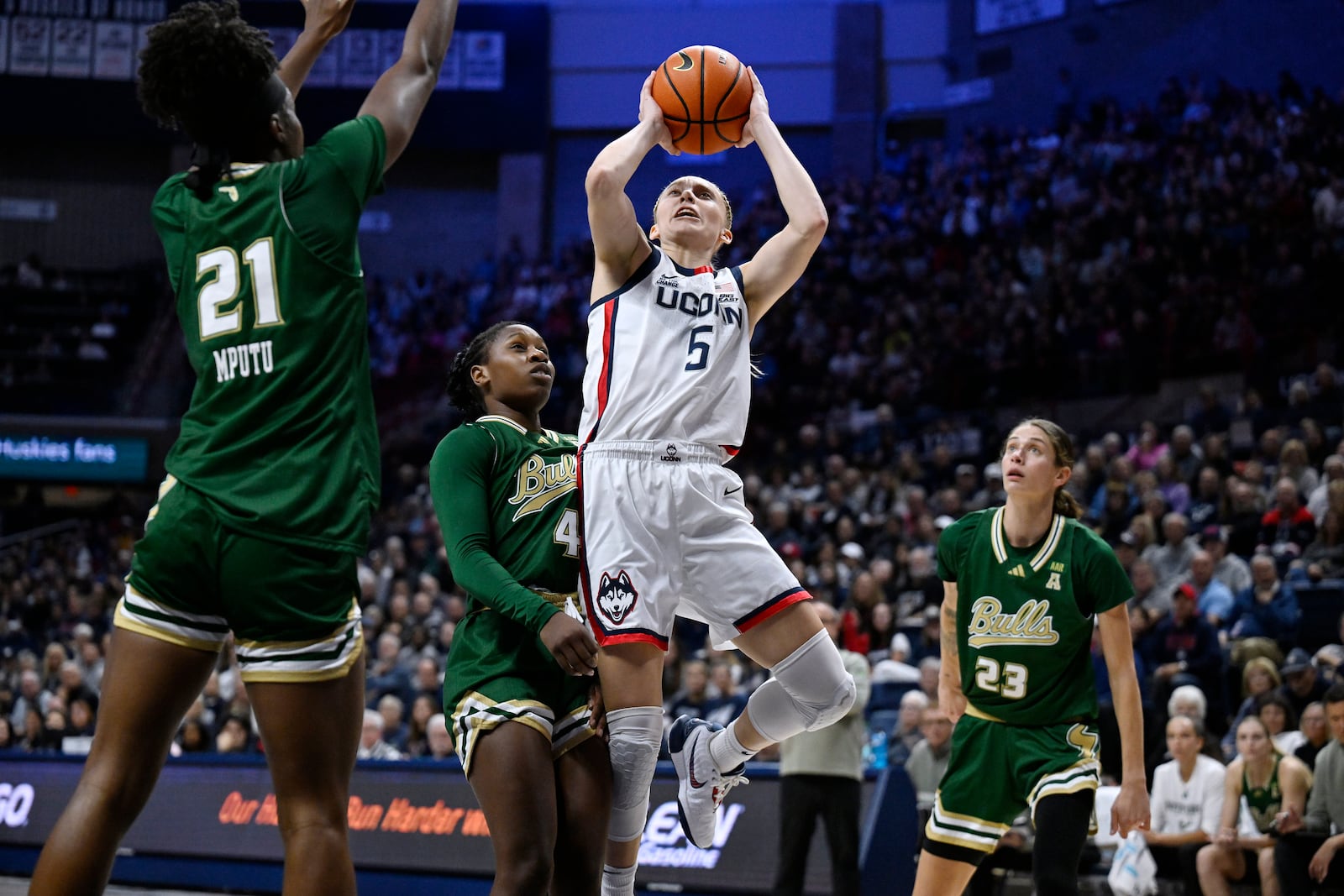 UConn guard Paige Bueckers (5) goes up for a basket against South Florida in the first half of an NCAA college basketball game, Sunday, Nov. 10, 2024, in Storrs, Conn. (AP Photo/Jessica Hill)