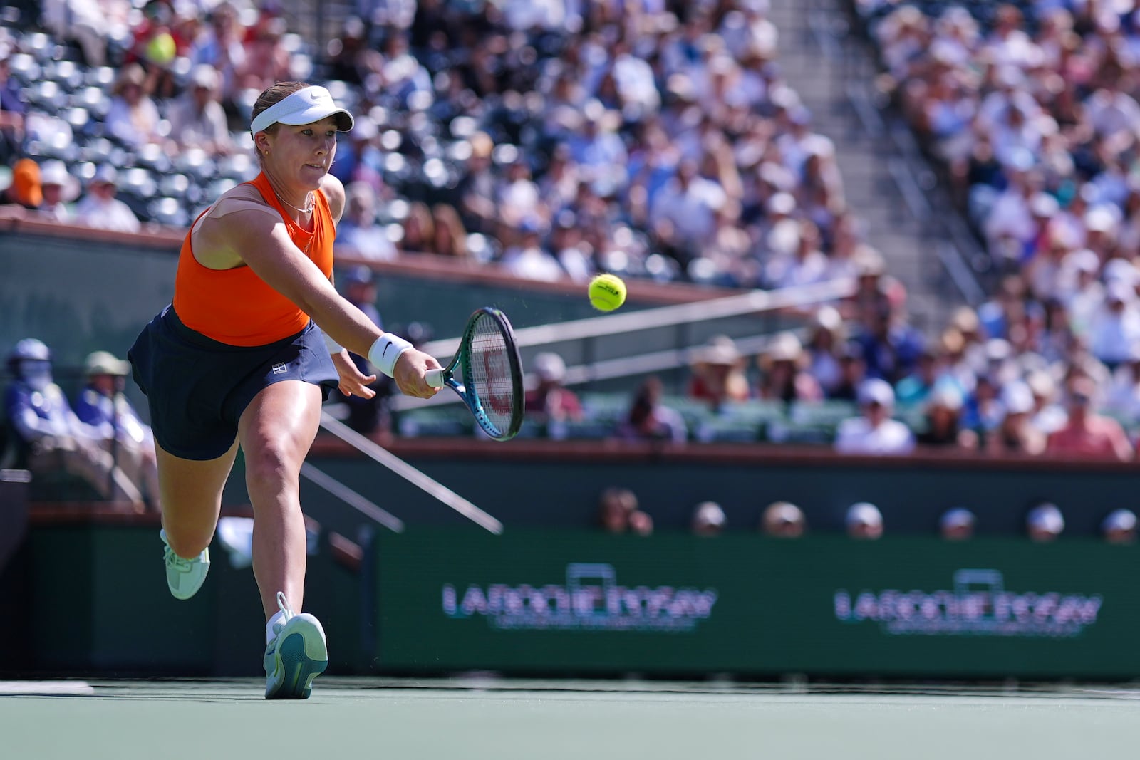 Mirra Andreeva, of Russia, returns to Aryna Sabalenka, of Belarus, during the final match at the BNP Paribas Open tennis tournament Sunday, March 16, 2025, in Indian Wells, Calif. (AP Photo/Mark J. Terrill)