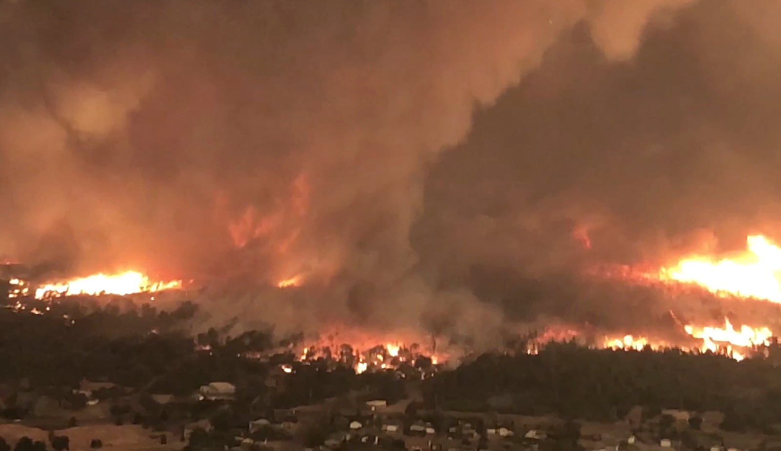 FILE - This image taken from video released by Cal Fire shows a fire tornado over Lake Keswick Estates, on July 26, 2018, near Redding, Calif. (Cal Fire via AP, File)