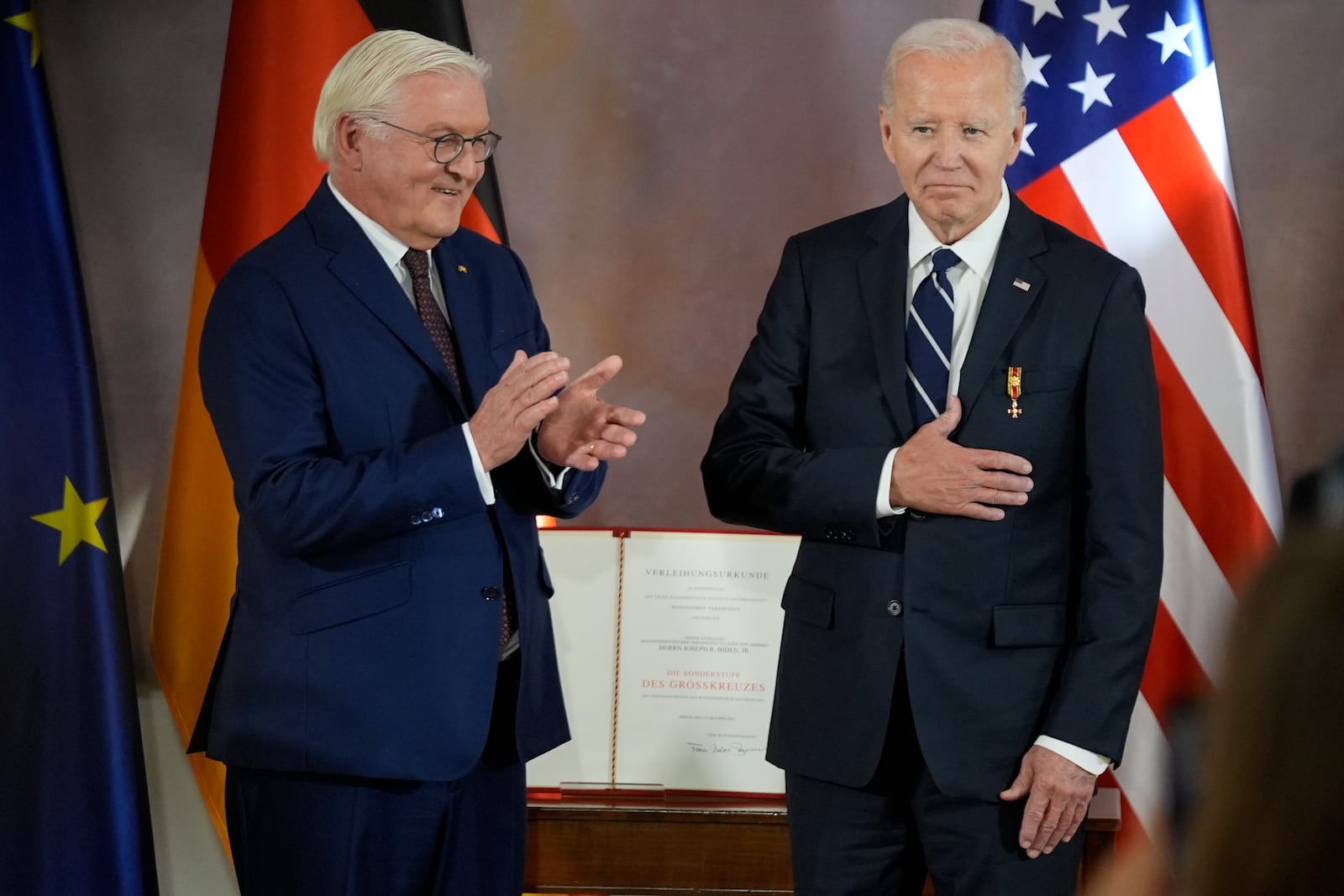 President Joe Biden receives Germany's Grand Cross special class of the Order of Merit by German President Frank-Walter Steinmeier at Bellevue Palace in Berlin, Germany, Friday, Oct. 18, 2024. (AP Photo/Matthias Schrader)