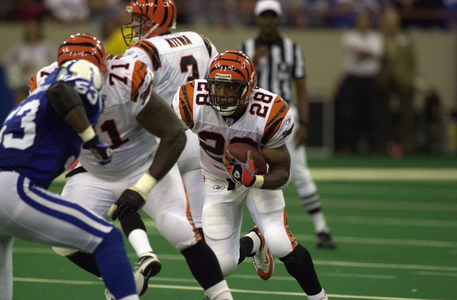 Former Bengals running back Corey Dillon runs behind a block by tackle Willie Anderson in a game against the Colts on October 6, 2002 in Indianapolis.