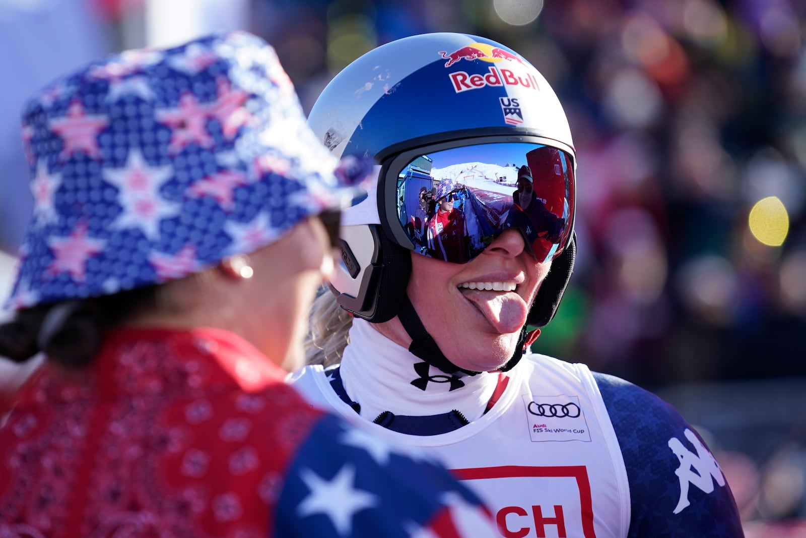 United States' Lindsey Vonn celebrates at the finish area of an alpine ski, women's World Cup super G, in St. Moritz, Switzerland, Saturday, Dec. 21, 2024. (AP Photo/Giovanni Auletta)