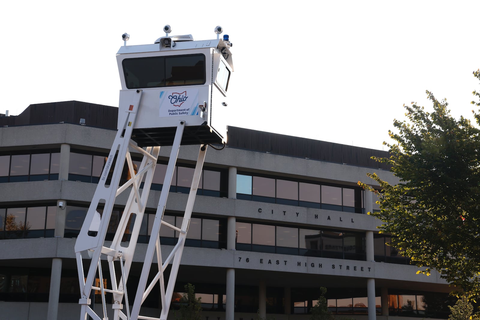 An Ohio Department of Public Safety surveillance tower rises over the parking lot across the street from Springfield City Hall on the morning of Monday, Sept. 16, 2024. BILL LACKEY / STAFF