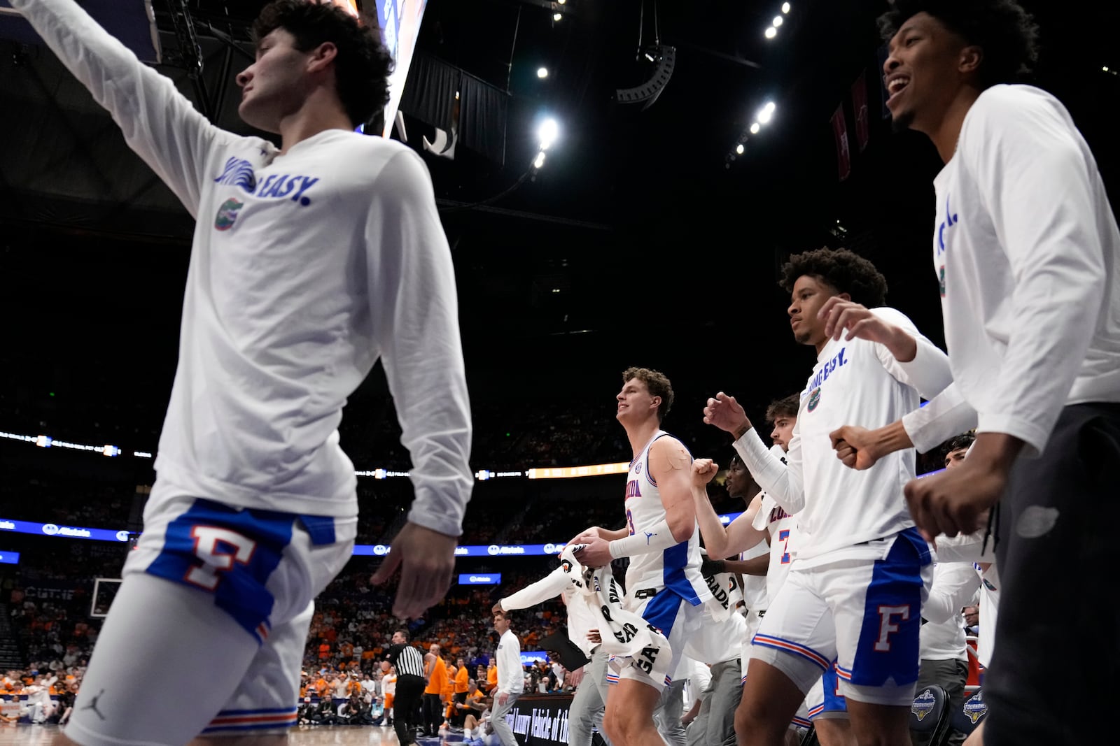 The Florida bench cheers play against Tennessee during the second half of an NCAA college basketball game in the final round of the Southeastern Conference tournament, Sunday, March 16, 2025, in Nashville, Tenn. (AP Photo/George Walker IV)