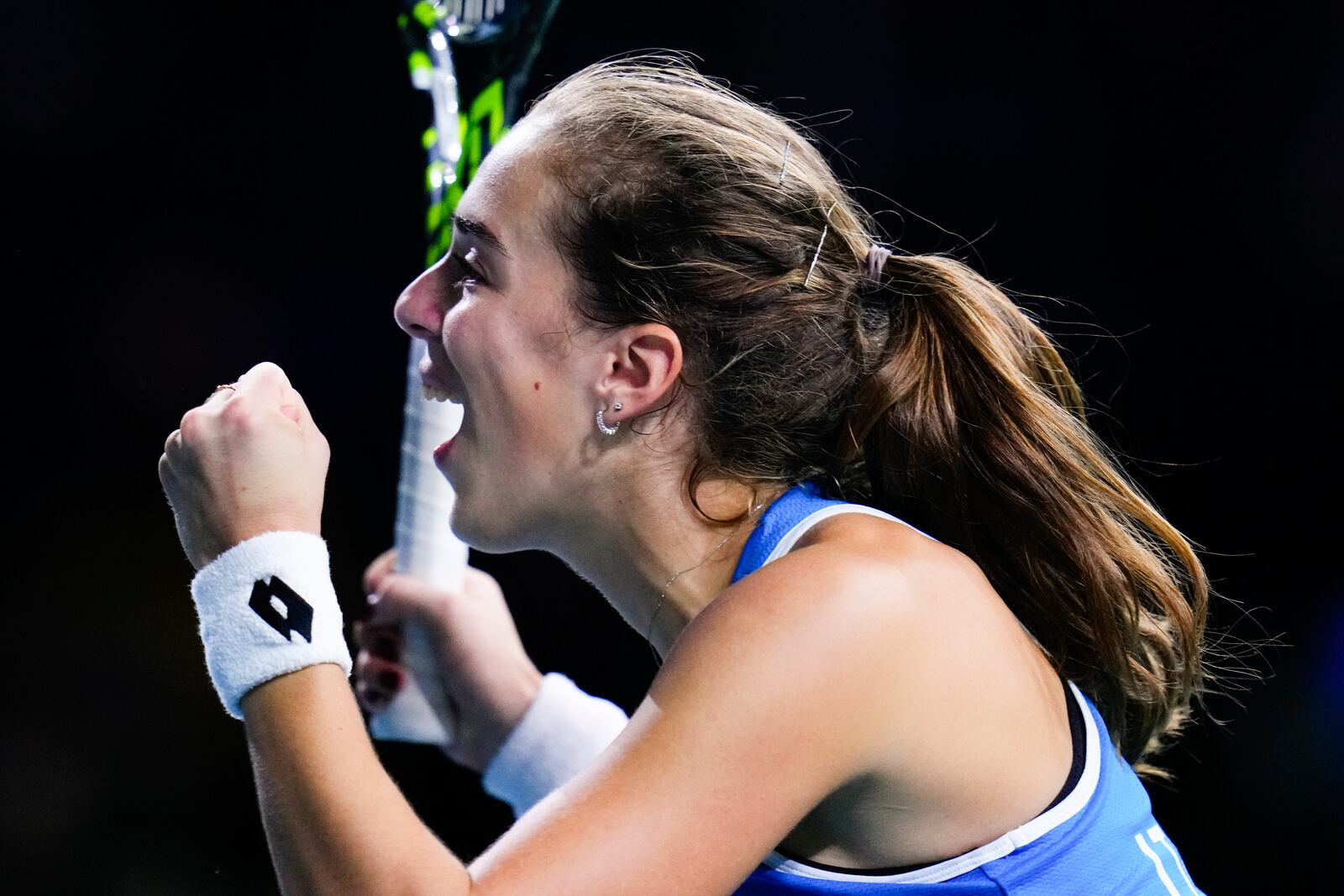 Italy's Lucia Bronzetti celebrates during the Billie Jean King Cup final against Slovakia's Viktoria Hruncakova at the Martin Carpena Sports Hall in Malaga, southern Spain, on Wednesday, Nov. 20, 2024. (AP Photo/Manu Fernandez)