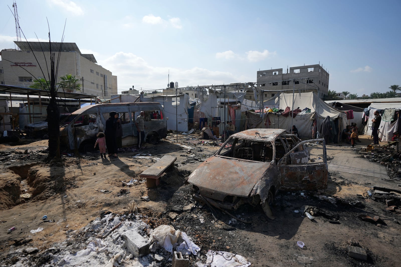 The site of a deadly fire, after an Israeli strike hit a tent area in the courtyard of Al Aqsa Martyrs hospital in Deir al-Balah, Gaza Strip, Wednesday, Oct. 16, 2024. (AP Photo/Abdel Kareem Hana)