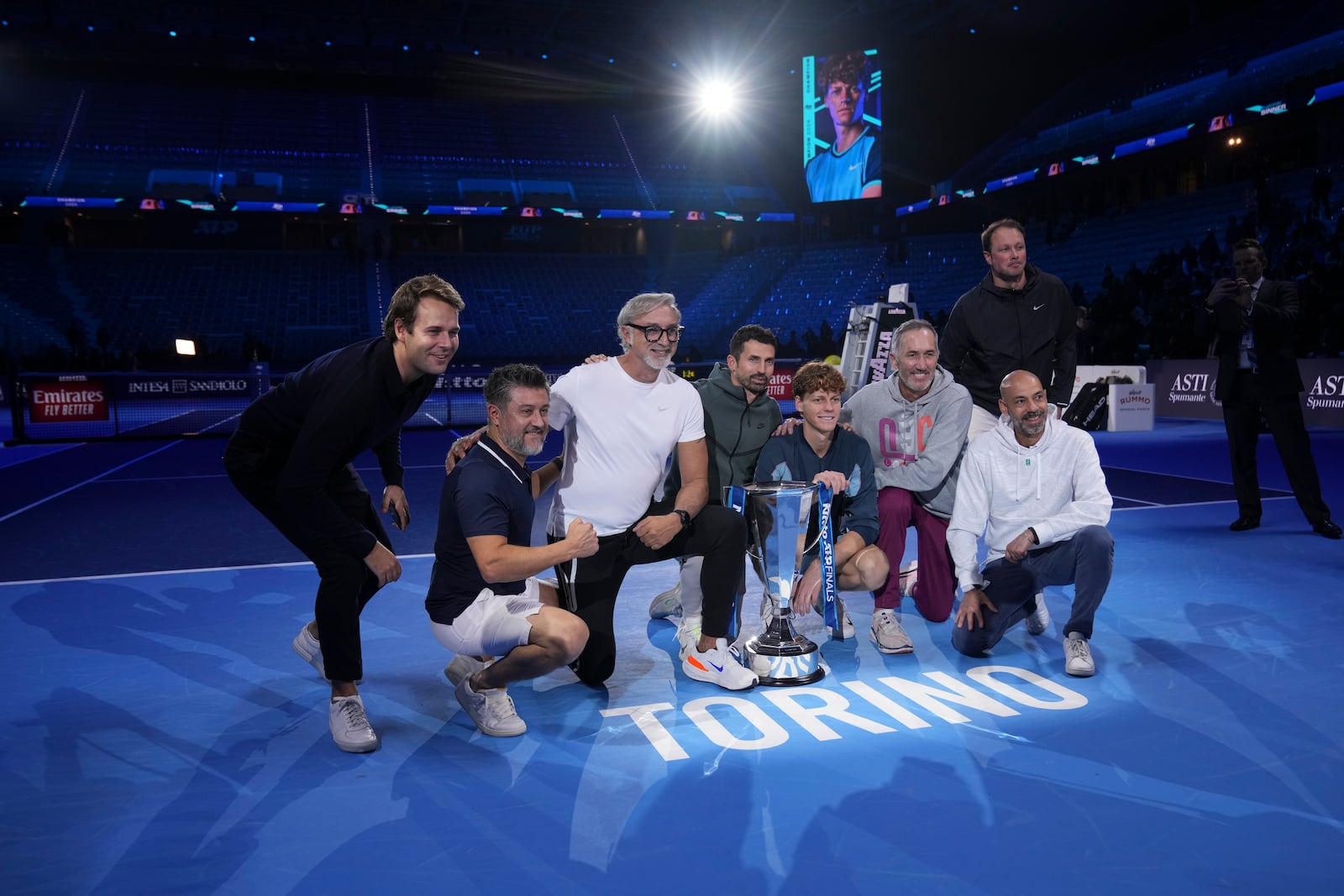 Italy's Jannik Sinner poses with his tean after winning the final match of the ATP World Tour Finals against Taylor Fritz of the United States at the Inalpi Arena, in Turin, Italy, Sunday, Nov. 17, 2024. (AP Photo/Antonio Calanni)