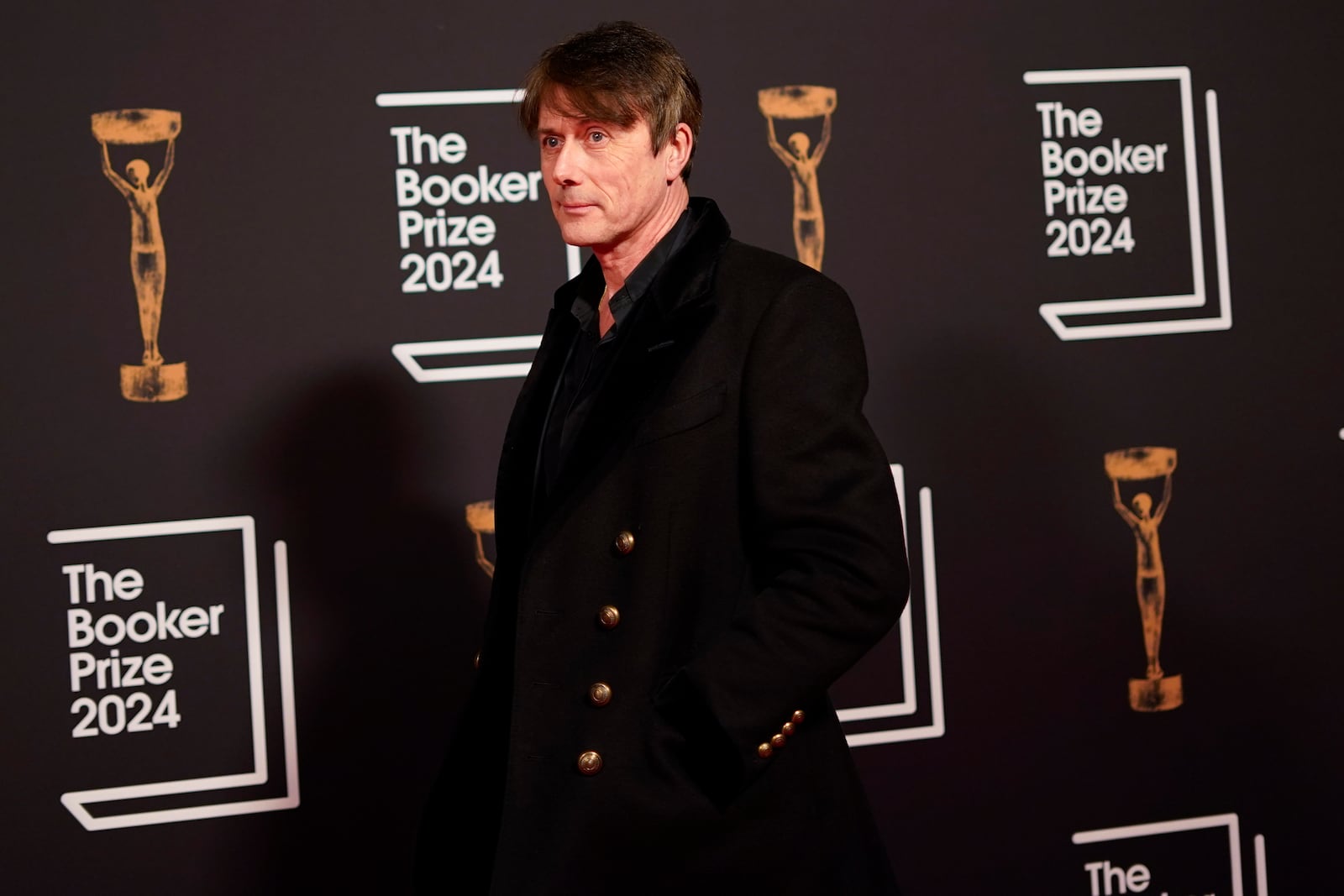 Brett Anderson arrives at the Booker Prize award dinner in London, Tuesday, Nov. 12, 2024. (AP Photo/Alberto Pezzali)