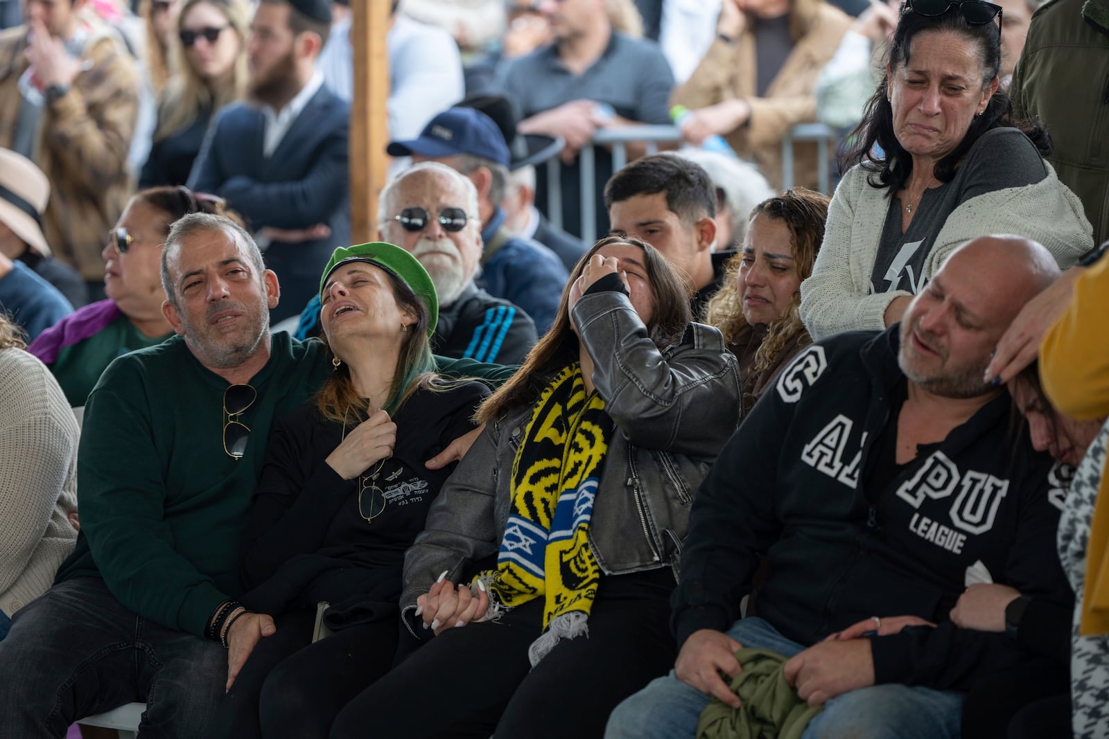 The family of Israeli soldier Sergeant Yahav Maayan who was killed in combat in the Gaza Strip, attends his funeral at a military cemetery in Modiin, Israel, Sunday, Jan. 12, 2025. (AP Photo/Ohad Zwigenberg)