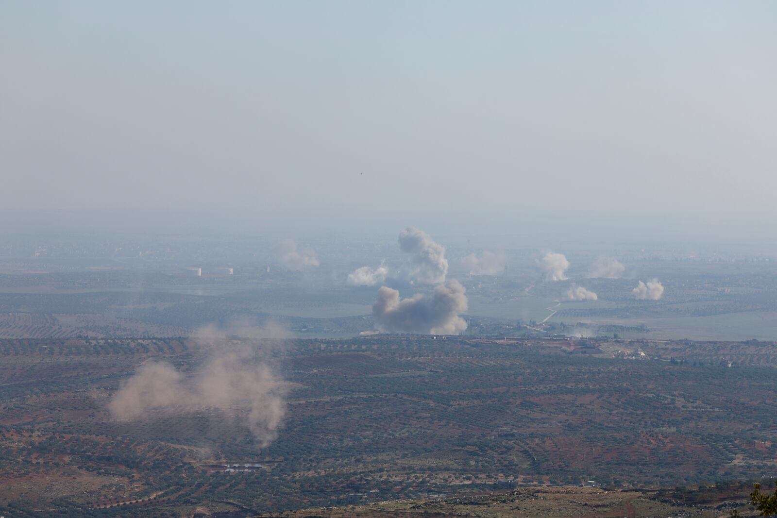 Smoke rises amid fighting between opposition factions and Syrian government troops in Dadikh, Aleppo countryside, Syria, Thursday, Nov. 28, 2024. (AP Photo/Ghaith Alsayed)