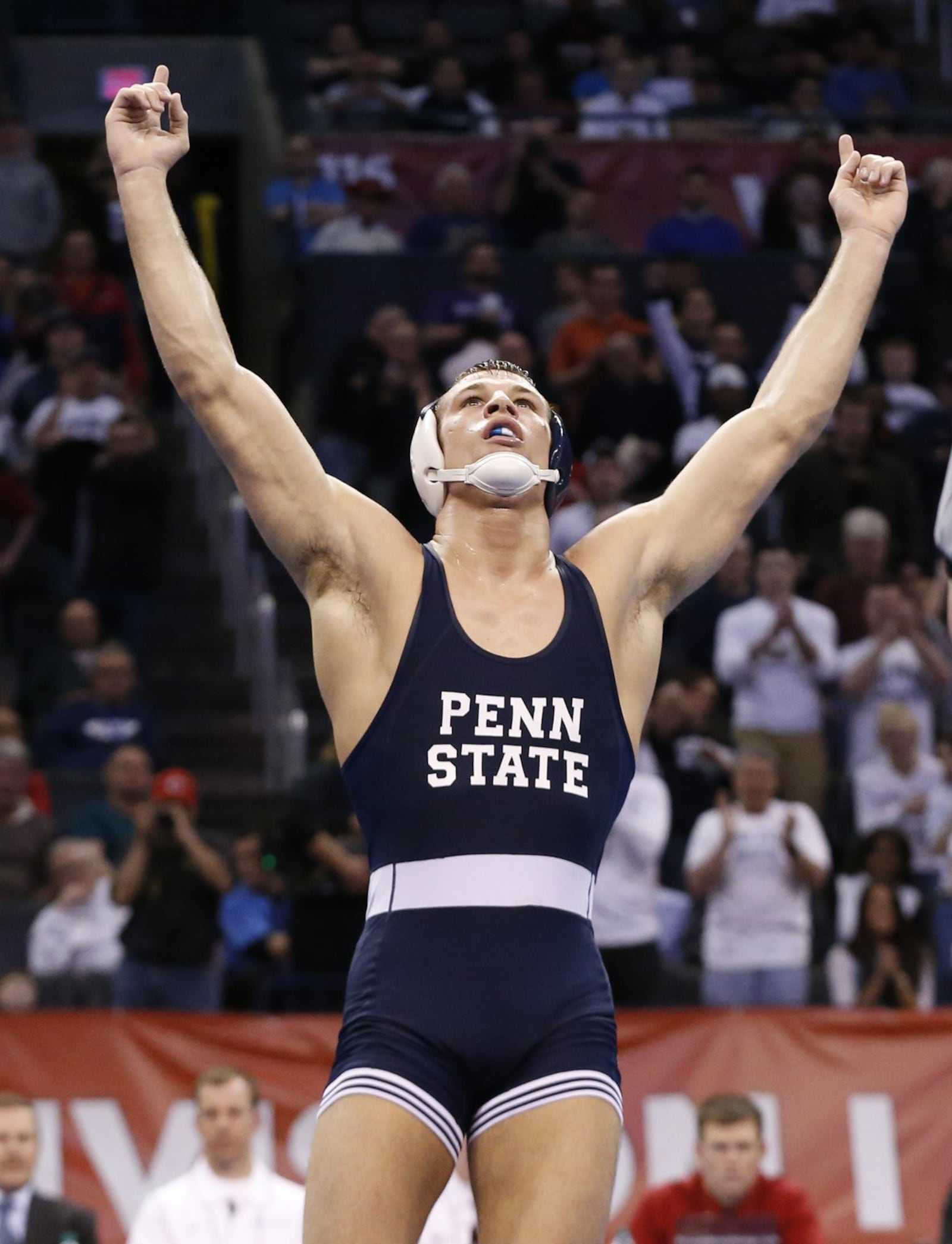 Penn State’s David Taylor celebrates after defeating Oklahoma State’s Tyler Caldwell in the 165-pound match in the finals of the NCAA Division I wrestling championships in Oklahoma City, Saturday, March 22, 2014. (AP Photo/Sue Ogrocki)