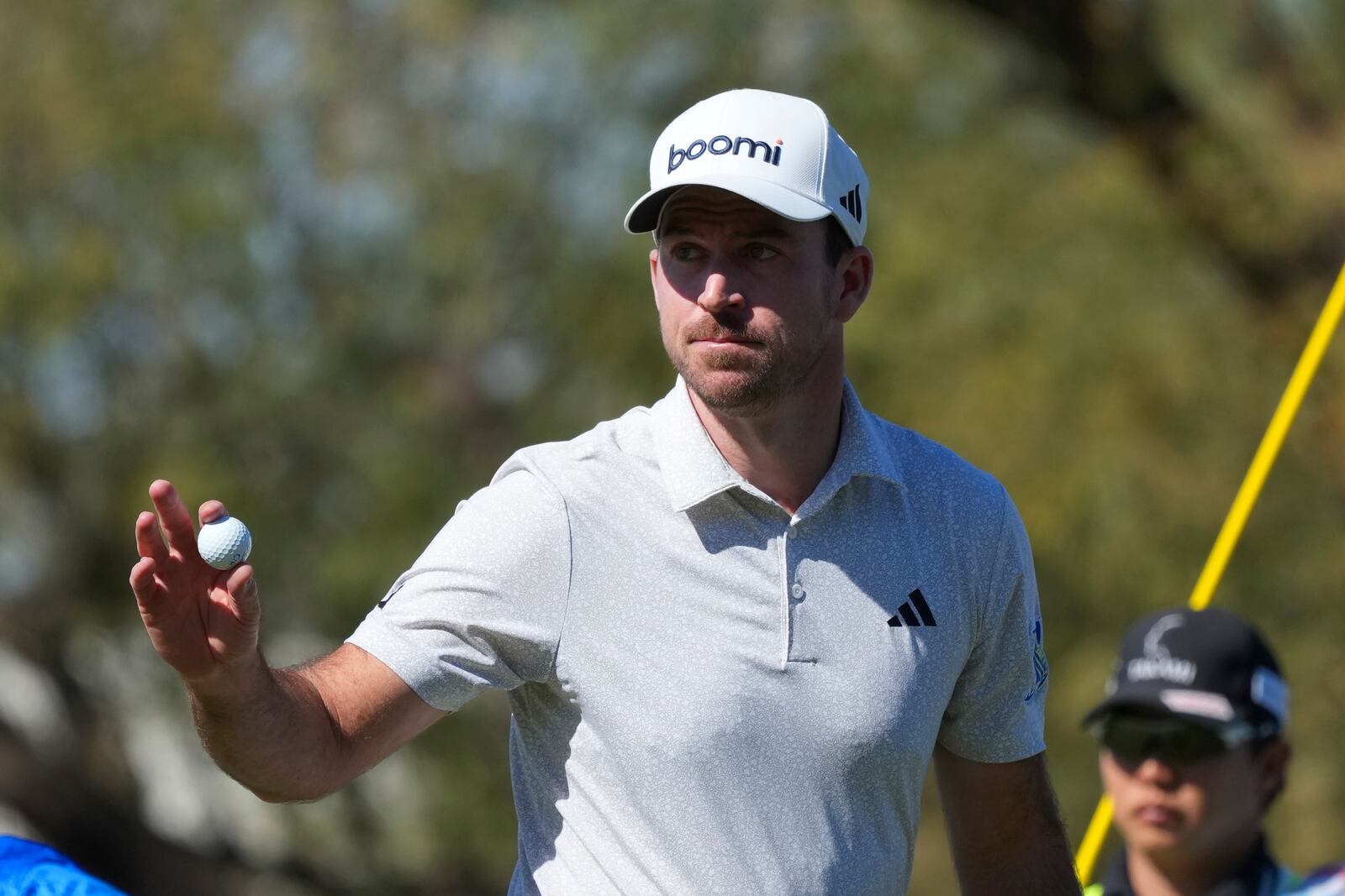 Nick Taylor, of Canada, waves to the crowd after making a birdie on the ninth hole during the first round of the Waste Management Phoenix Open PGA Tour golf tournament at the TPC Scottsdale Thursday, Feb. 6, 2025, in Scottsdale, Ariz. (AP Photo/Ross D. Franklin)