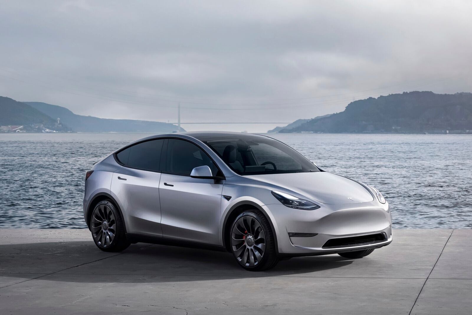 This photo provided by Tesla shows the 2024 Model Y. This popular small electric SUV can go up to an estimated 320 miles on a full charge. (Courtesy of Tesla Motors via AP)