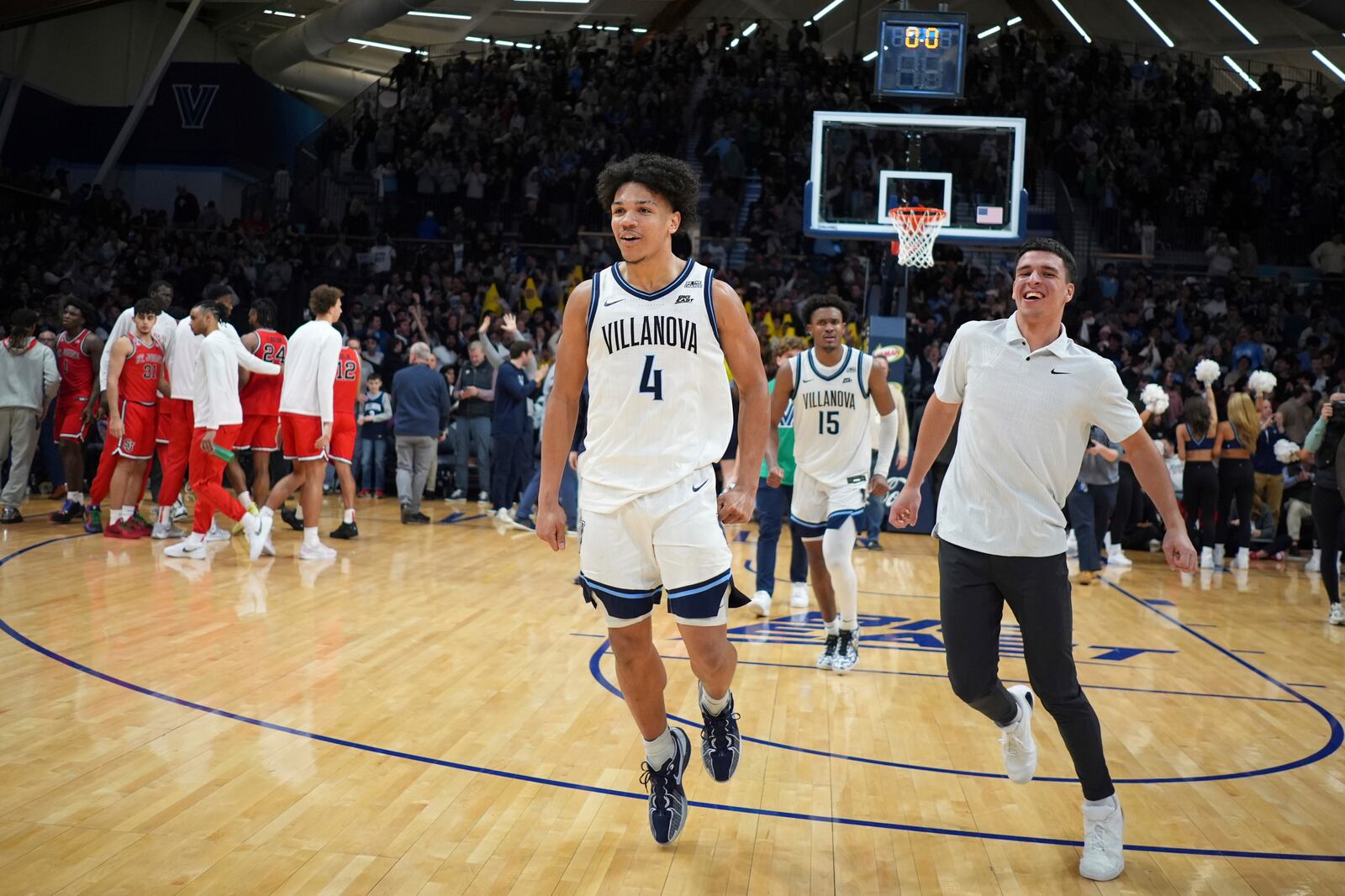 Villanova's Tyler Perkins celebrate after Villanova won an NCAA college basketball game against St. John's, Wednesday, Feb. 12, 2025, in Villanova, Pa. (AP Photo/Matt Slocum)