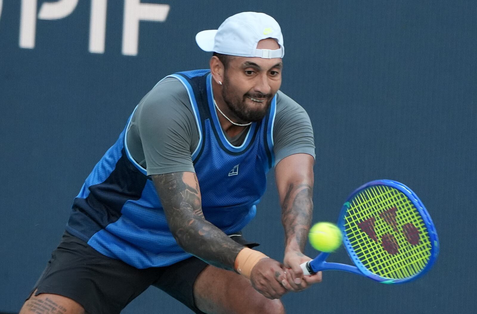 Nick Kyrgios, of Australia, hits a return to Mackenzie McDonald during the Miami Open tennis tournament, Wednesday, March 19, 2025, in Miami Gardens, Fla. (AP Photo/Lynne Sladky)