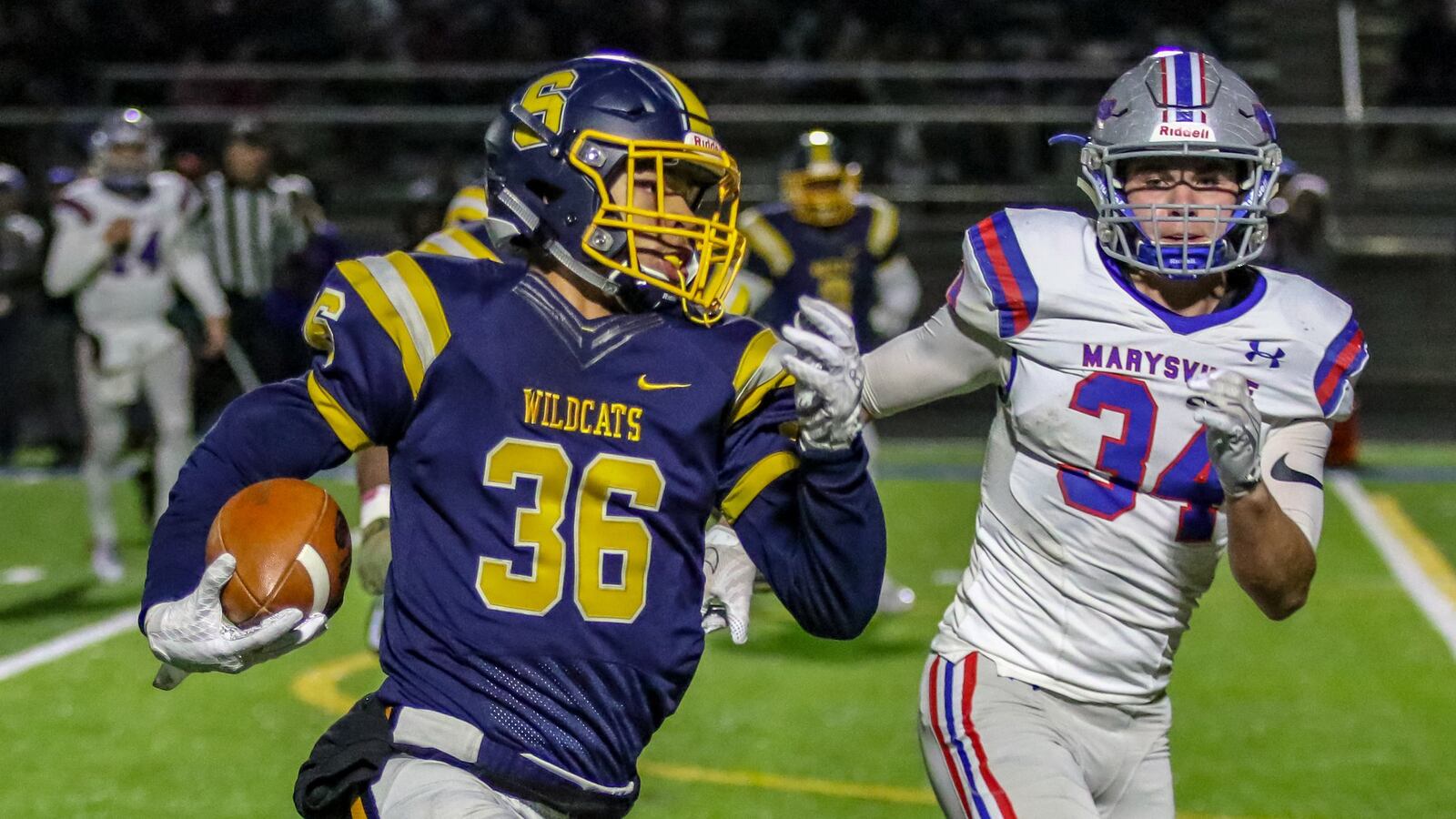 Springfield High School’s Delian Bradley returns a fumble during a Division I, Region 2 quarterfinal game against Marysville last season at Springfield High School. The Wildcats on 23-0. CONTRIBUTED PHOTO BY MICHAEL COOPER