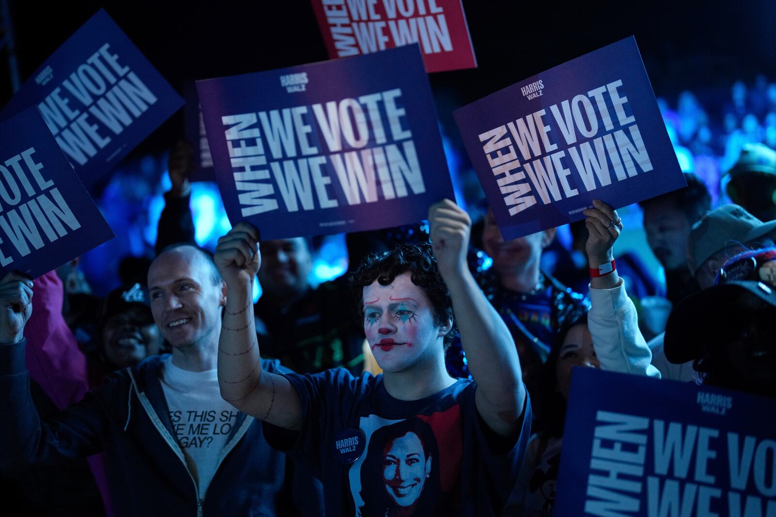 Supporters in costume hold signs during a campaign rally for Democratic presidential nominee Vice President Kamala Harris, Thursday, Oct. 31, 2024, in North Las Vegas. (AP Photo/John Locher)