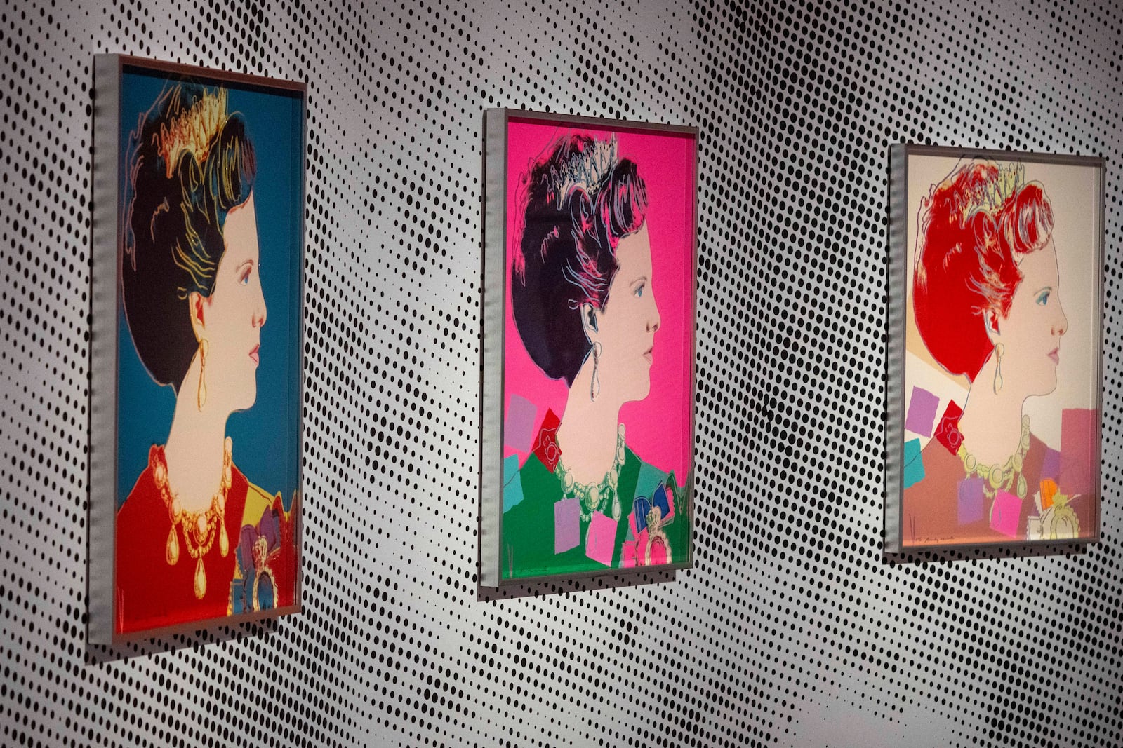 Screen prints depicting Queen Margrethe II of Denmark, part of a series of sixteen prints of four queens titled Reigning Queens, 1985, by Andy Warhol at museum Paleis Het Loo in Apeldoorn, Netherlands, Wednesday, Oct. 9, 2024, similar to a Warhol work stolen from a gallery in Oisterwijk, Netherlands, early Friday, Nov. 1, 2024. (AP Photo/Peter Dejong)