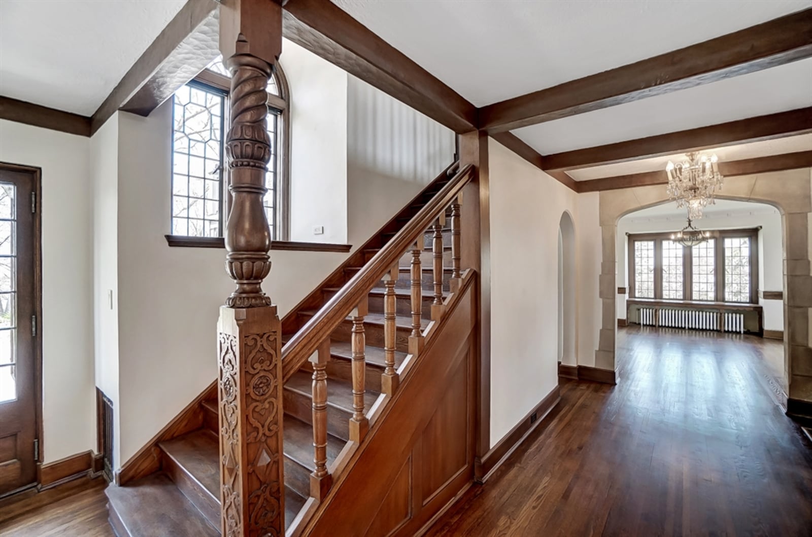 Built in 1927, much of the original craftsmanship has been maintained and the hardwood floors refinished. Leaded-glass windows fill large rooms with natural light and wide limestone entryways and hallways transition to formal and casual living spaces. 