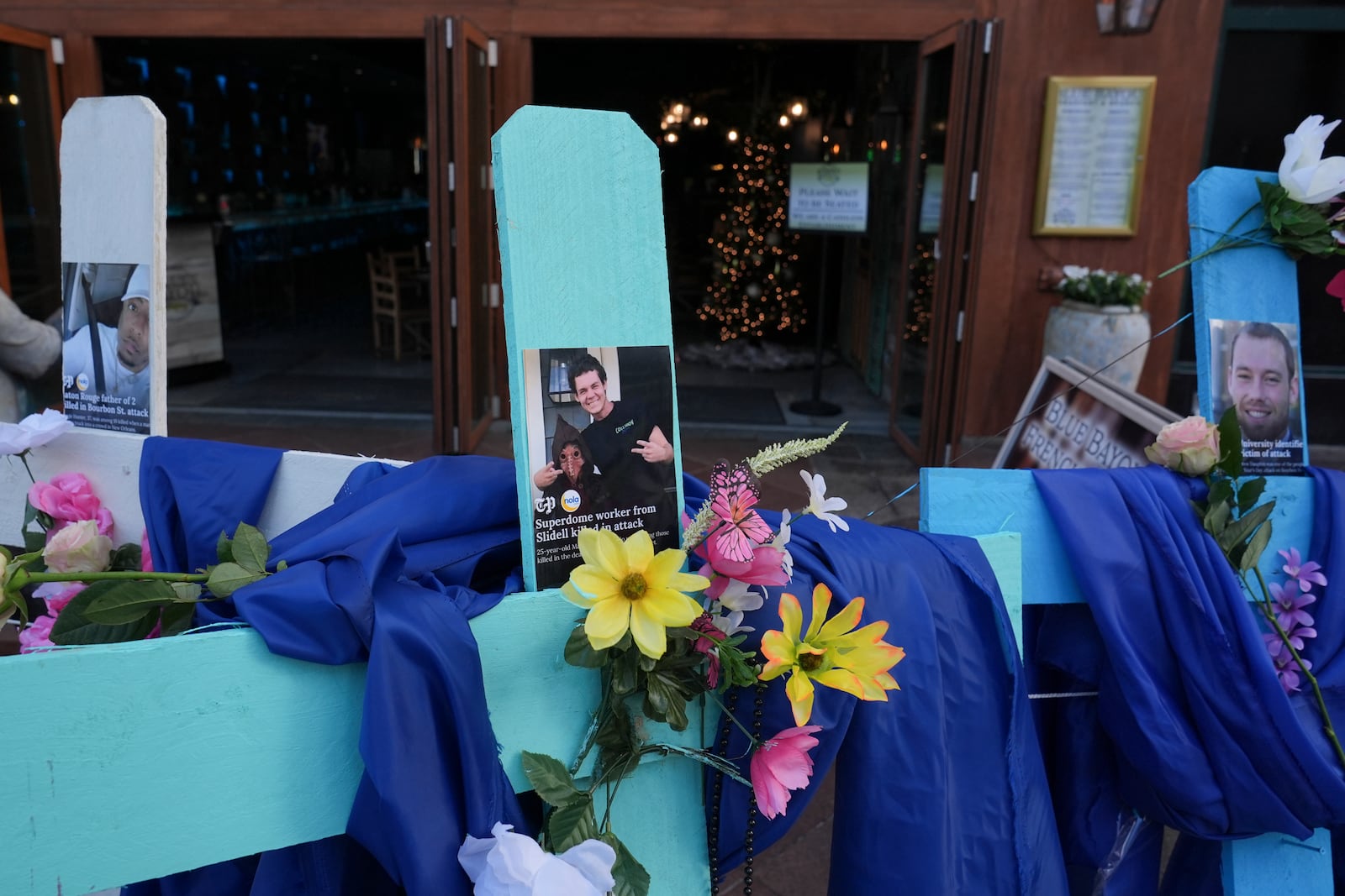 A memorial to the victims of a deadly truck attack is seen on Canal Street in the French Quarter, Friday, Jan. 3, 2025, in New Orleans. (AP Photo/George Walker IV)