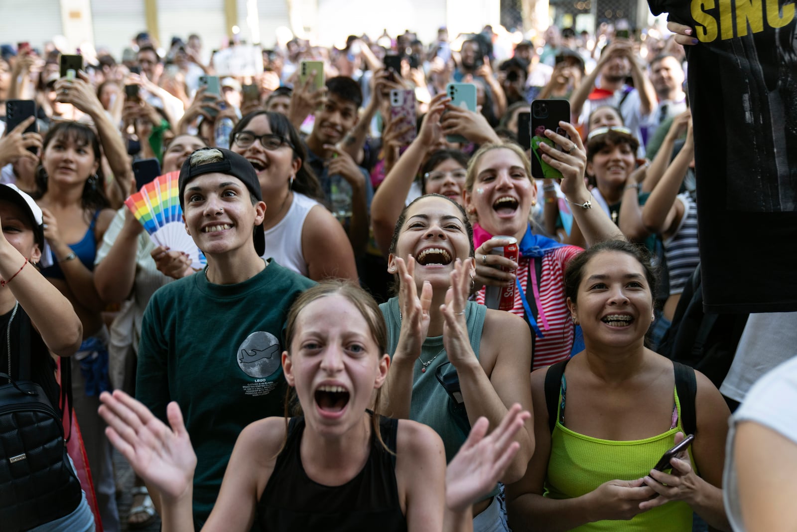 People cheer on the singer Lali Esposito in Buenos Aires, Argentina, Saturday, Feb. 1, 2025, during a protest against President Javier Milei’s speech at the World Economic Forum in Davos, during which he criticized “sick wokeism,” social welfare, feminism, identity politics and the fight against climate change. (AP Photo/Rodrigo Abd)