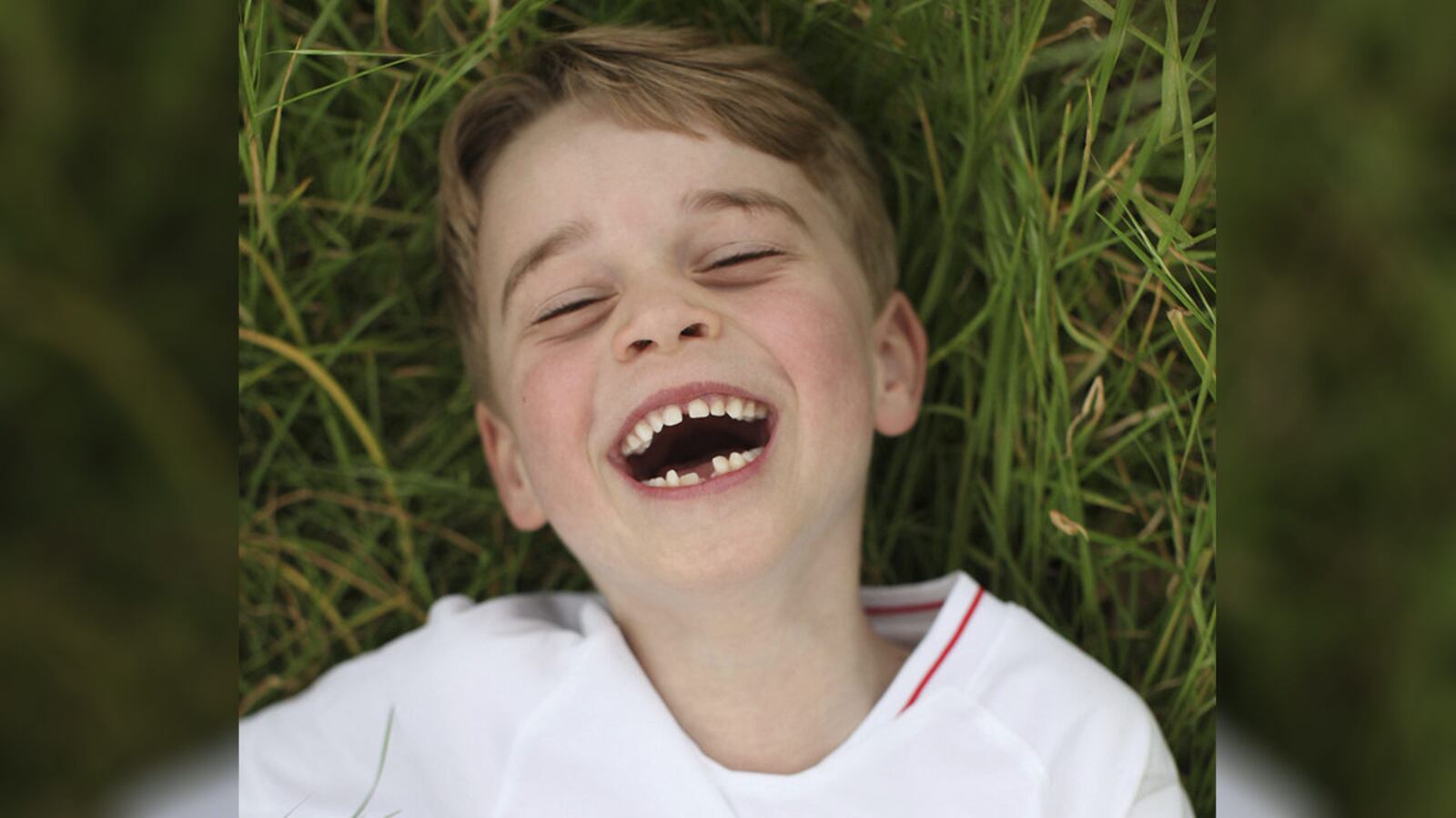 In this undated photo released by the Duke and Duchess of Cambridge on Sunday, July 21, 2019, Britain's Prince George poses for a photo taken by his mother, Kate, the Duchess of Cambridge, in the garden of their home at Kensington Palace, London.