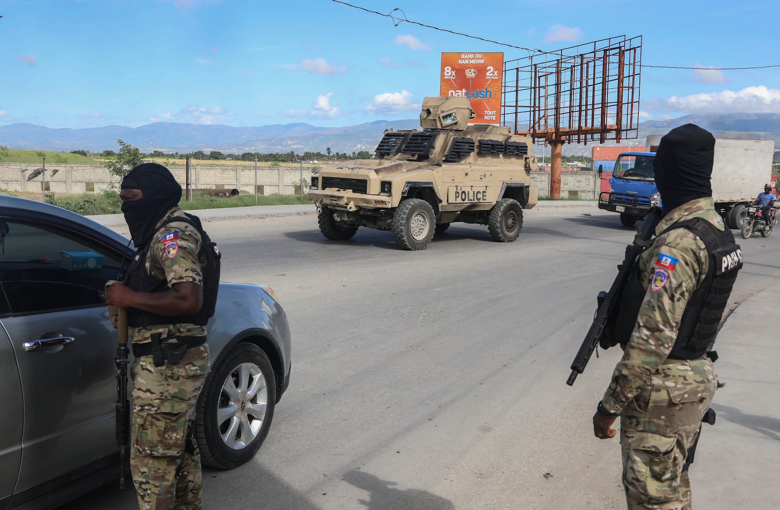 Police officers patrol near the Toussaint Louverture International Airport in Port-au-Prince, Haiti, Tuesday, Nov. 12, 2024. (AP Photo/Odelyn Joseph)