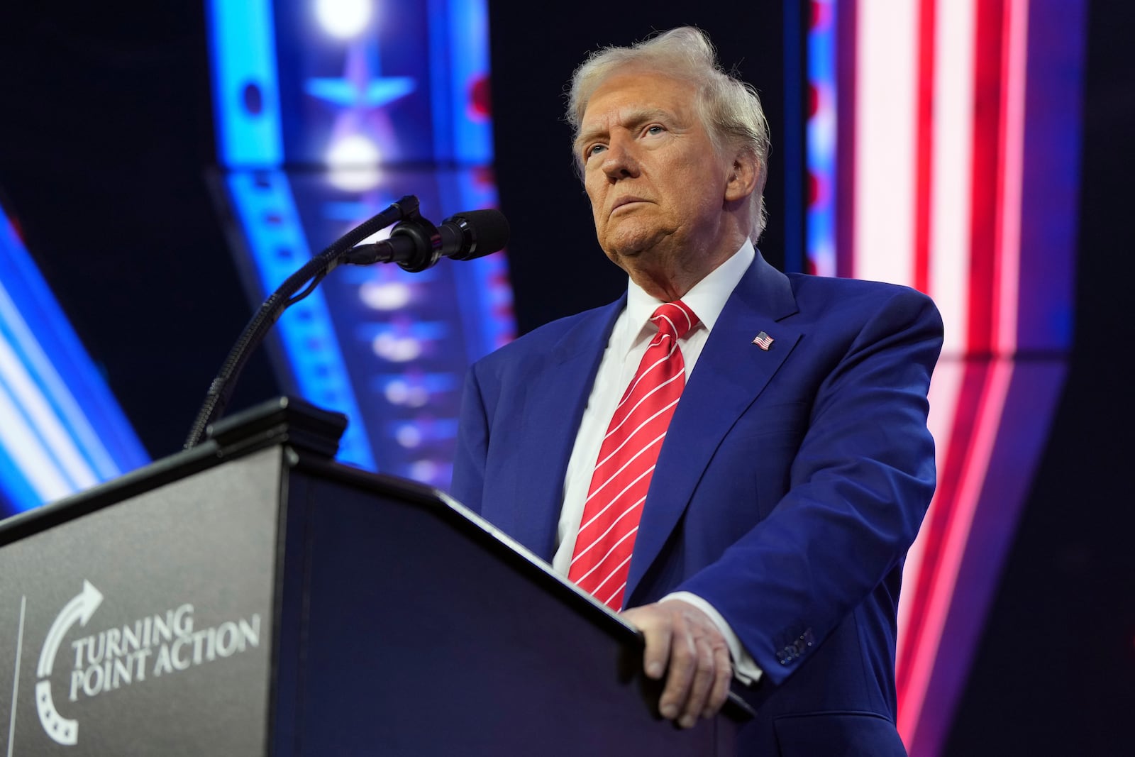 President-elect Donald Trump speaks at AmericaFest, Sunday, Dec. 22, 2024, in Phoenix. (AP Photo/Rick Scuteri)