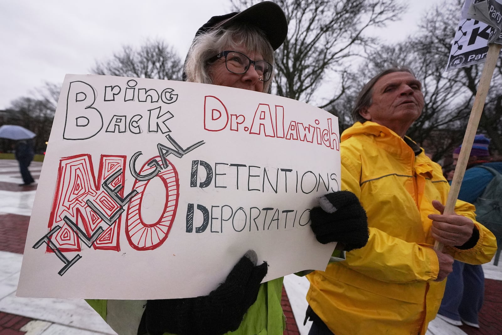 Protesters rally outside the Rhode Island State House in support of deported Brown University Dr. Rasha Alawieh, Monday, March 17, 2025, in Providence, R.I. (AP Photo/Charles Krupa)