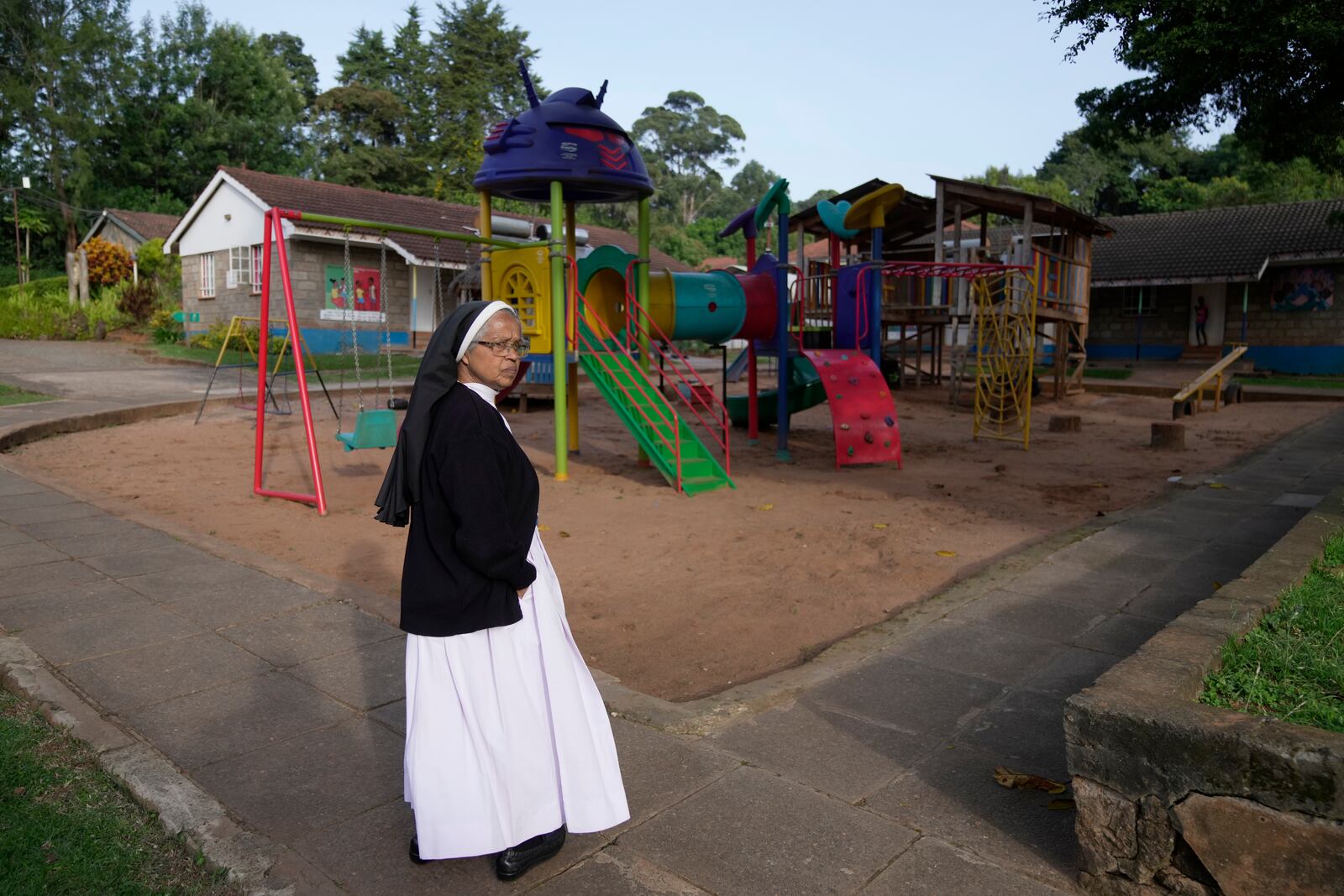 Sister Tresa Pallakudy stands at the Nyumbani Children's Home compound, the orphanage which is heavily reliant on foreign donations, cares for over 100 children with HIV whose parents died of the disease and provides them with housing, care, and PEPFAR supplied anti-retroviral drugs in Nairobi, Kenya Thursday, Oct. 6, 2025. (AP Photo/Brian Inganga)