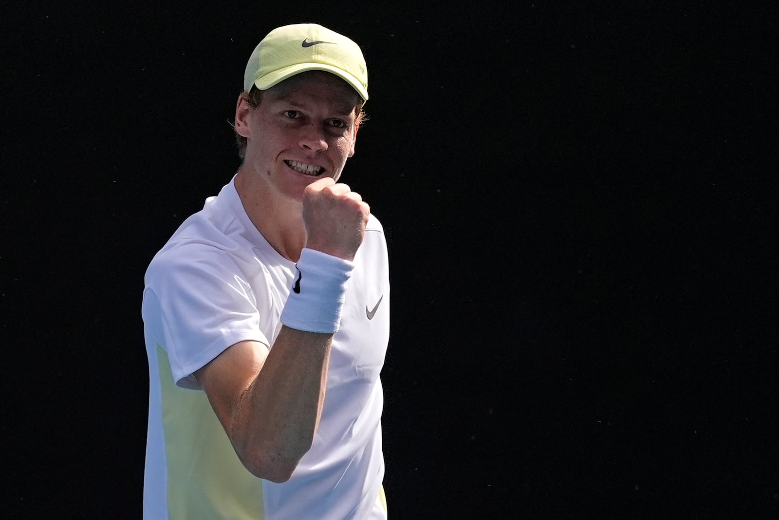 Jannik Sinner of Italy celebrates after defeating Holger Rune of Denmark in their fourth round match at the Australian Open tennis championship in Melbourne, Australia, Monday, Jan. 20, 2025.(AP Photo/Asanka Brendon Ratnayake)