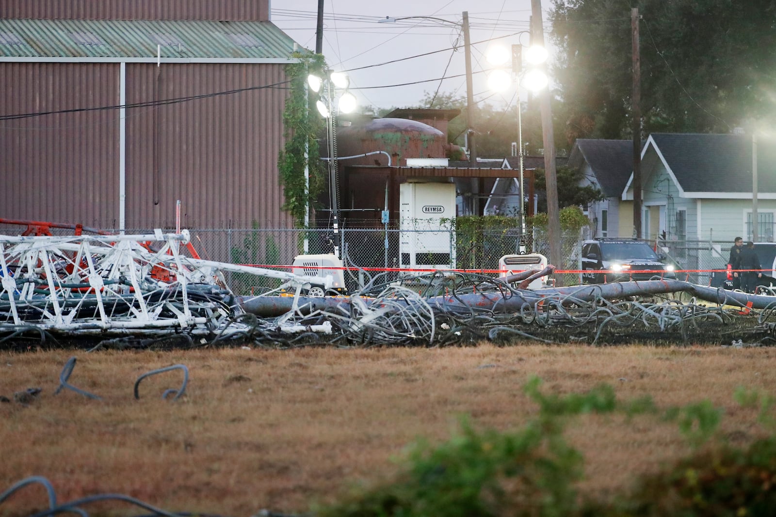 A view from the north side of the collapsed radio tower where a helicopter collided with the structure, killing all aboard Monday, Oct. 21, 2024 in Houston. (Michael Wyke/Houston Chronicle via AP)