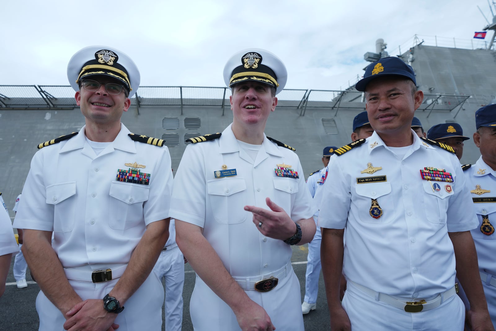 Daniel A. Sledz, center, commanding officer of USS Savannah, meets with Cambodian Deputy Commander of Ream Naval Base, Capt. Mean Savoeun, right, as it arrives for a port call at Sihanoukville port, Cambodia, Monday, Dec. 16, 2024. (AP Photo/Heng Sinith)