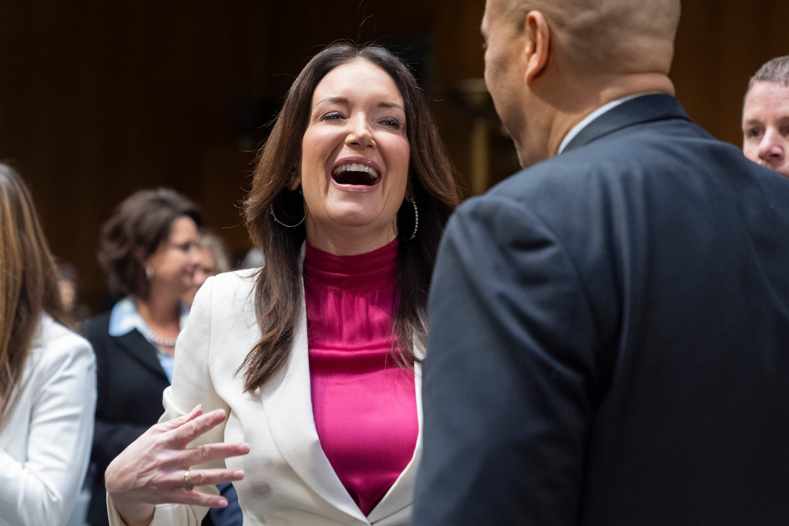 Brooke Rollins, left, is greeted by Sen. Cory Booker, D-N.J., during a Senate Agriculture, Nutrition, and Forestry Committee hearing on her nomination for Secretary of Agriculture, Thursday, Jan. 23, 2025, in Washington. (AP Photo/Jacquelyn Martin)