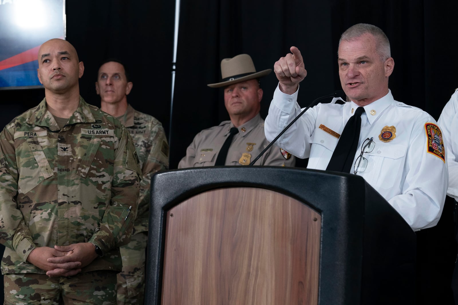 D.C. Fire and EMS Chief John Donnelly, right, speaks as Col. Francis Pera, commander of the U.S. Army Corps of Engineers, listens during a news conference at Ronald Reagan Washington National Airport, Sunday, Feb. 2, 2025, in Arlington, Va. (AP Photo/Jose Luis Magana)